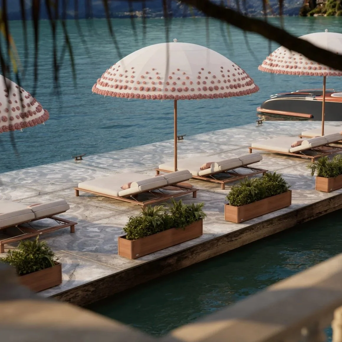 Beach chairs with cushions and pink umbrellas on a floating deck by a swimming pool, with potted plants along the edge.