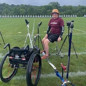 Photo of Karen Sternfeld on the shooting line at an outdoor archery range