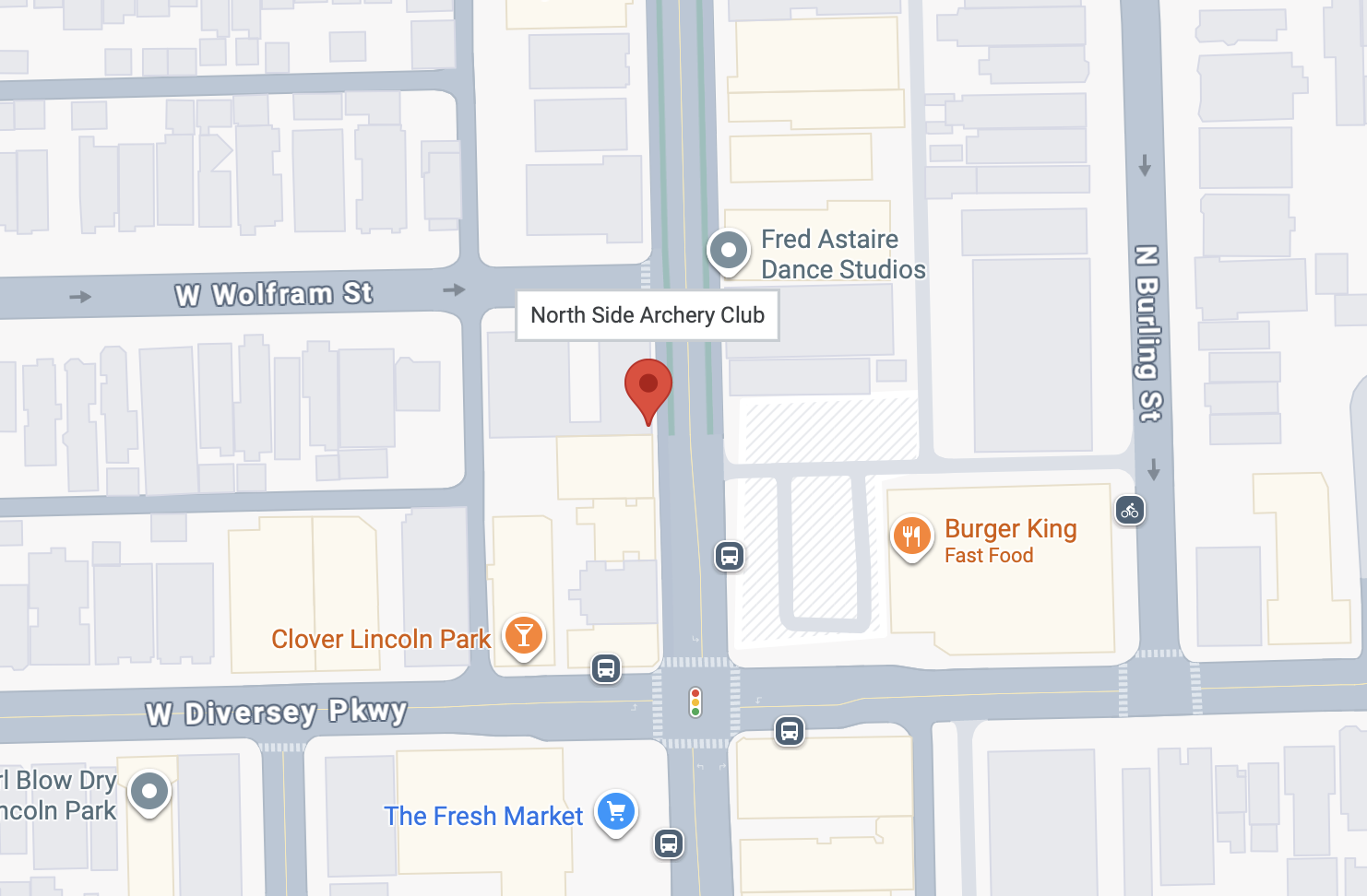 Map showing the intersection of West Wolfram Street and North Builing Street, featuring nearby locations such as North Side Archery Club, Fred Astaire Dance Studios, Burger King, Clover Lincoln Park, and The Fresh Market, with bus stops and bike spots indicated.