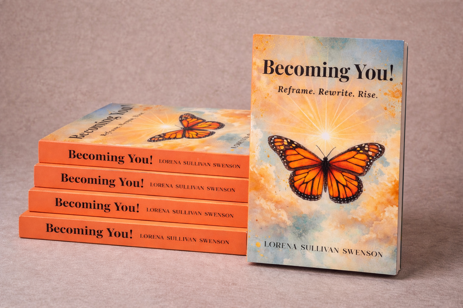 A stack of five copies of the book titled 'Becoming You!' by Lorena Sullivan Swenson with a bright orange and blue cover featuring a butterfly and cloud background, and one additional copy standing upright showing the cover design.