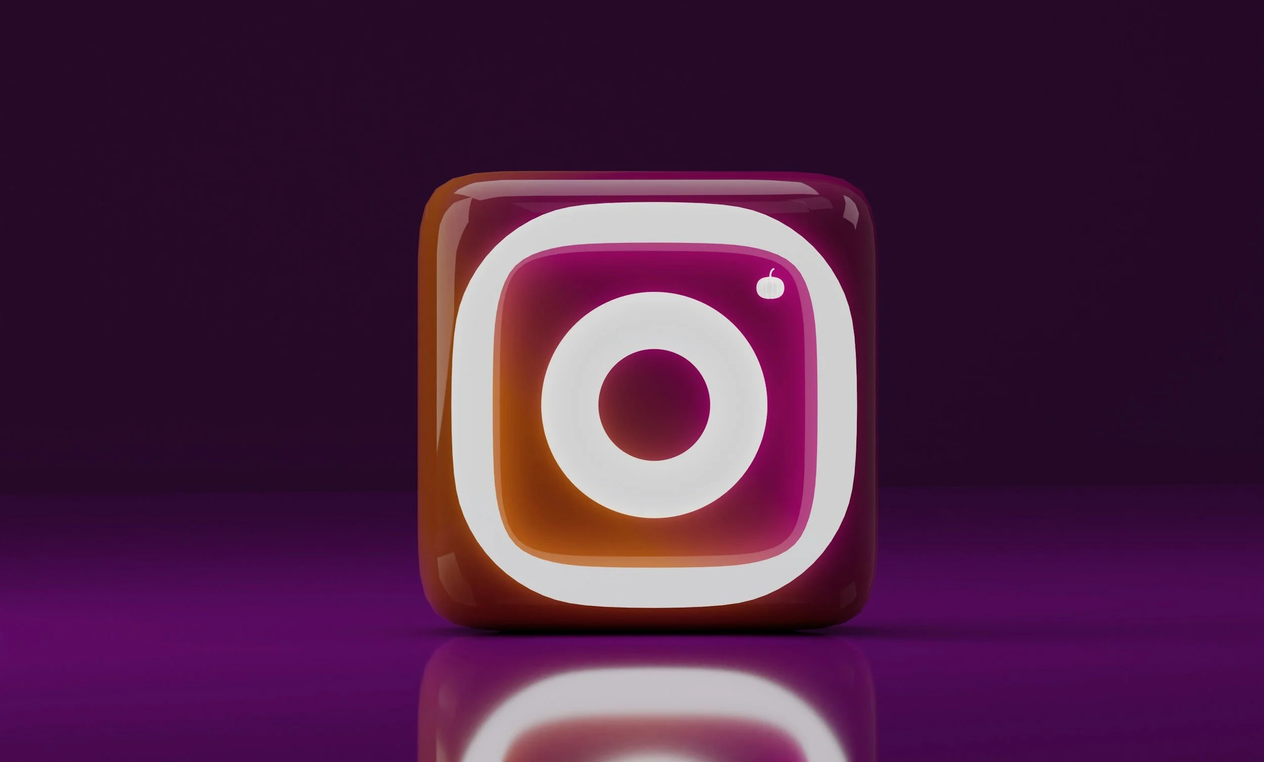 3D neon-style Instagram icon with a purple and orange glow on a dark background.