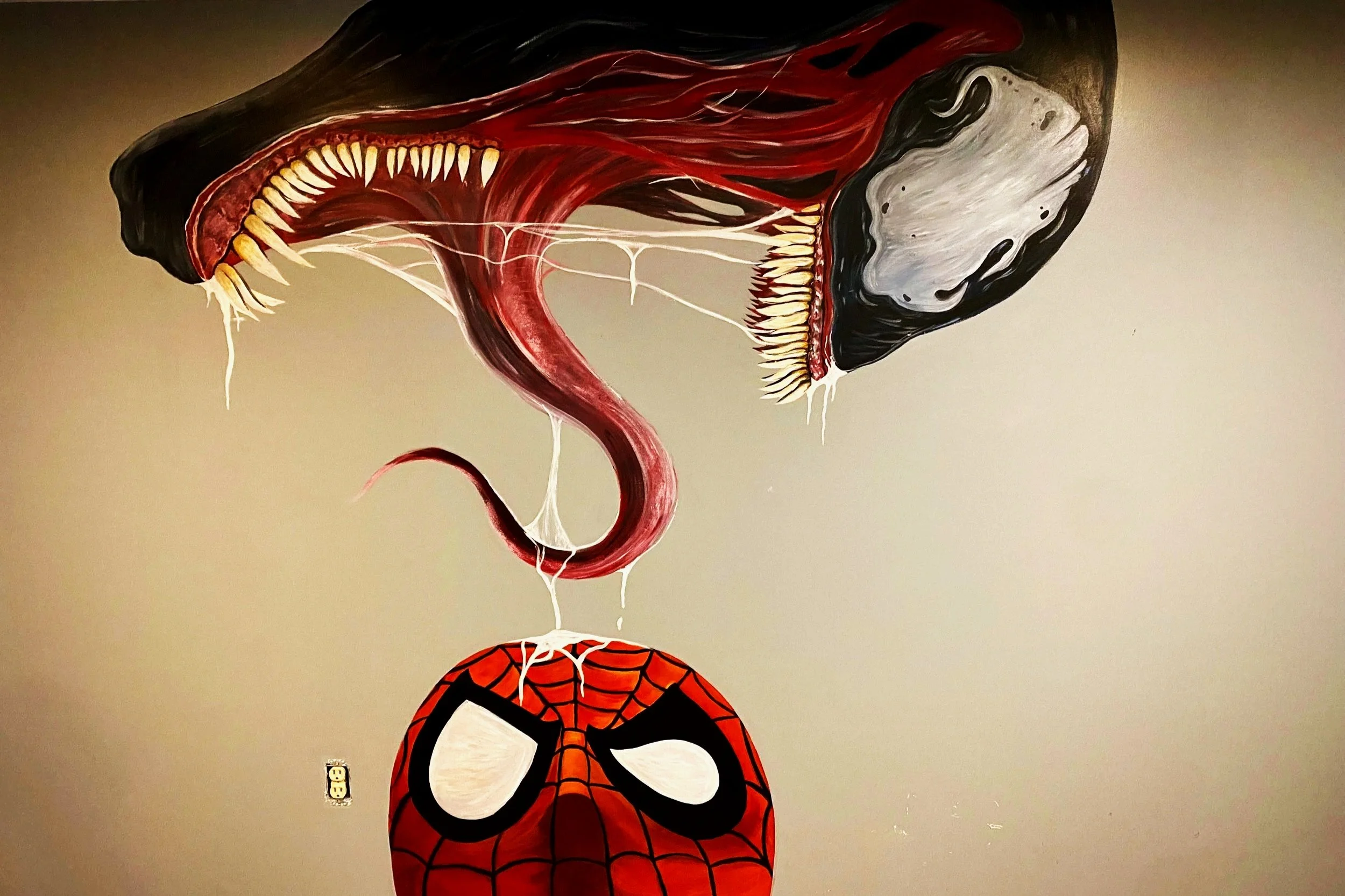 Large gaming room mural in residential home of Venom and Spider-man painted by Edmonton, AB artist Carly Marie Murals