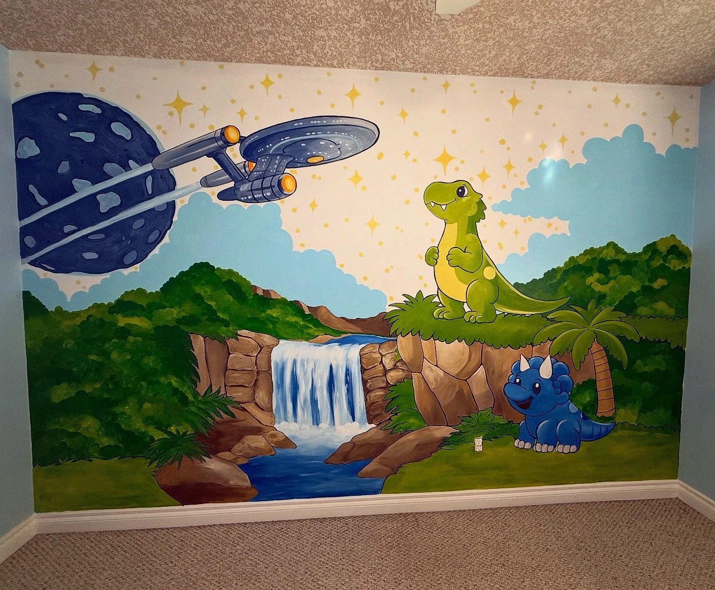 Colorful cartoon mural of a spaceship flying past a planet with a sci-fi design, a waterfall flowing into a river, a green dinosaur with a wide smile and big eyes, a blue triceratops with a cheerful expression, set in a lush jungle landscape with trees, rocks, and a cloudy sky.