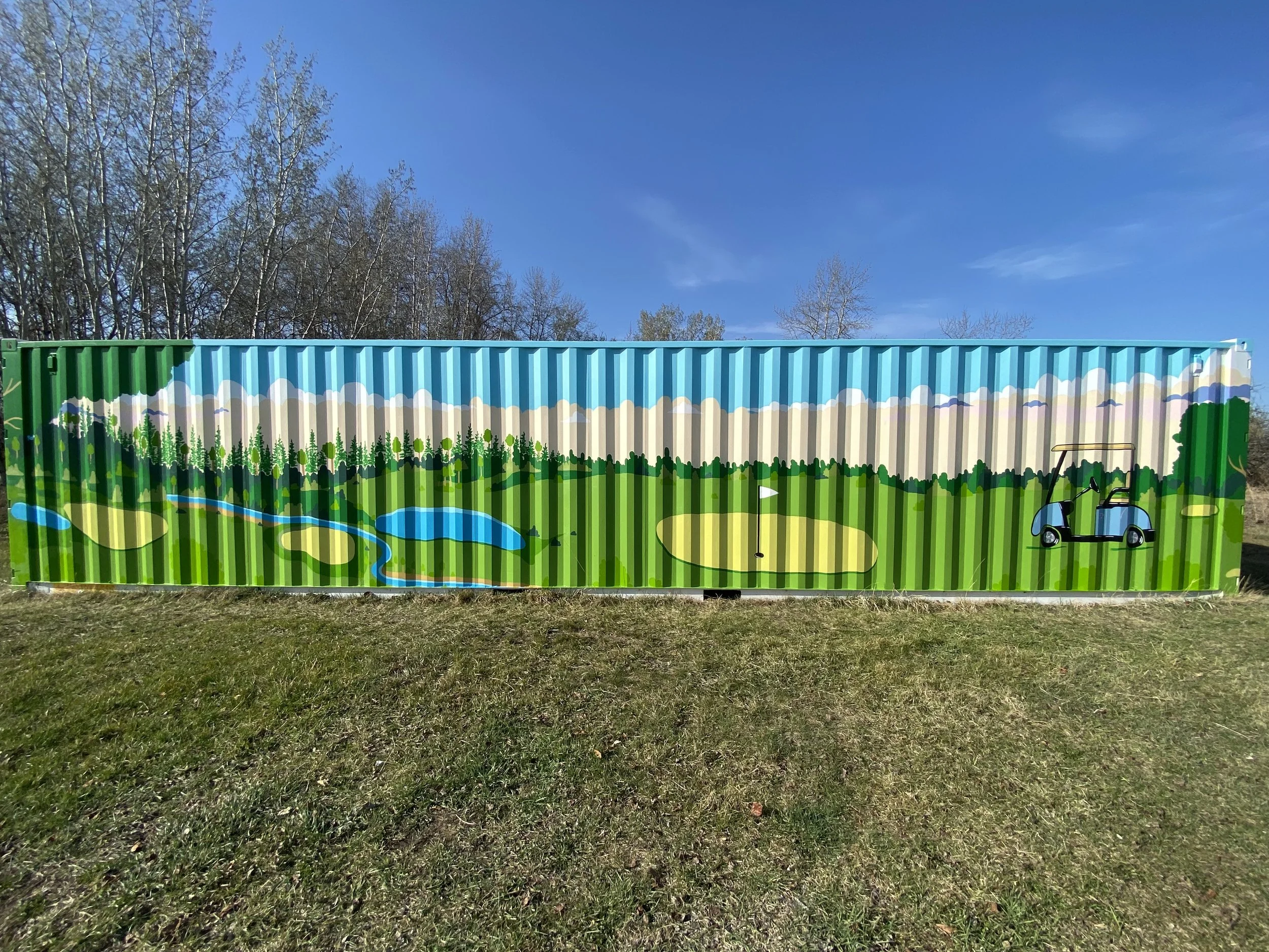 Scenic golf scene grass and golf greens with treee line and colorful sky painted mural on shipping container at Ponoka Community Golf Course