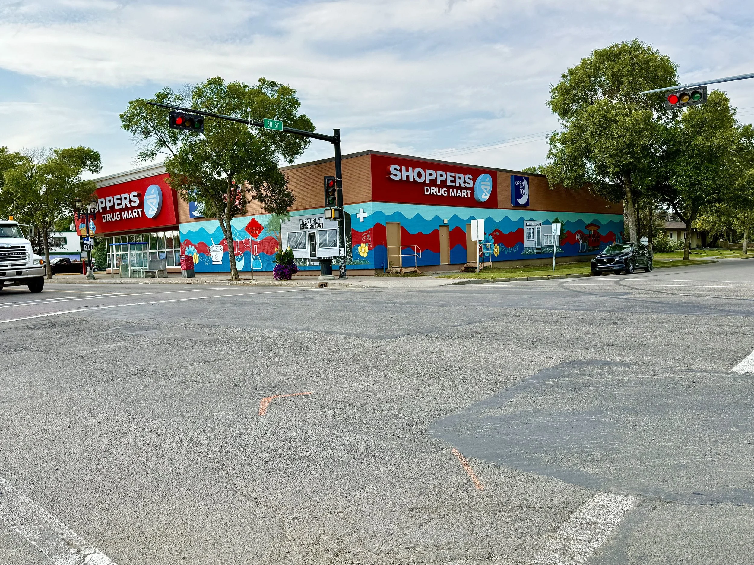 Shopper's Drug Mart Beverly Edmonton, Ab large scale mural painted by Carly Marie Murals and Robert Murray Murals for  Beverly Business Association 