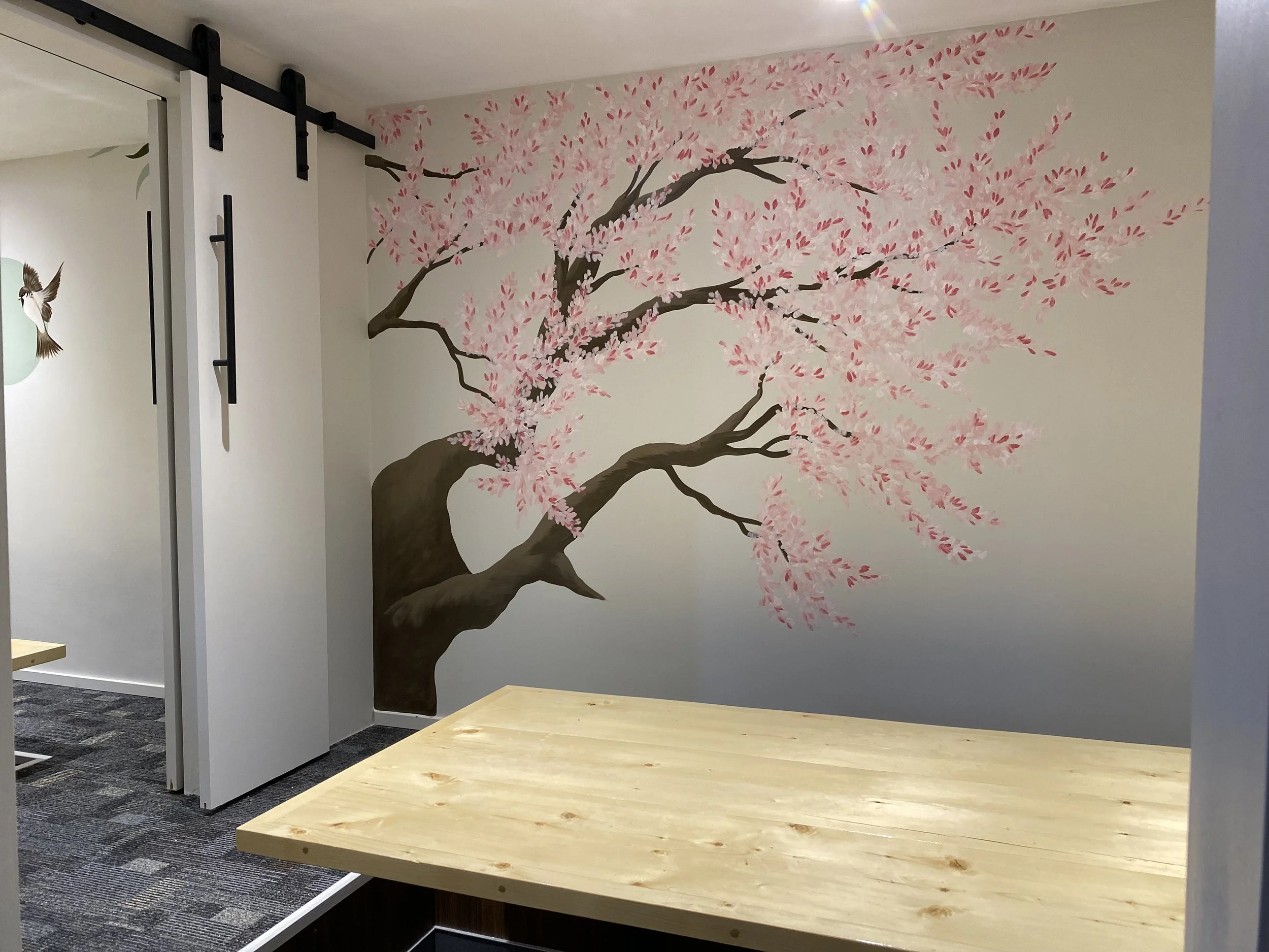Hand painted mural of Cherry Blossom tree located at Sushi Toshi south Edmonton in private sushi room