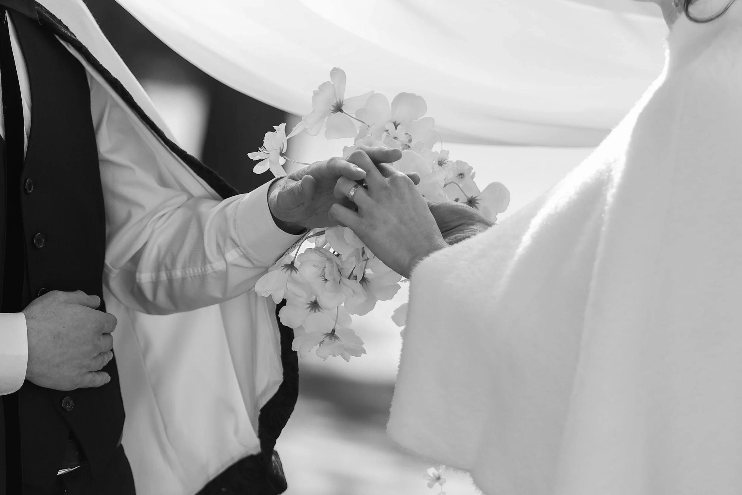 A photo of a wedding ring during in a detail shot during a ceremony