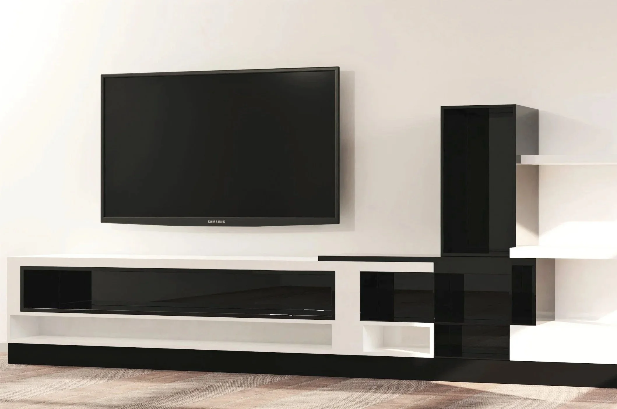 Modern black and white entertainment center with a wall-mounted flat-screen TV, a black cabinet, and white shelves against a plain wall, with a hardwood floor in front.