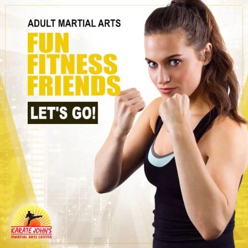 Adult woman in a self-defense stance with hand up ready to protect herself.