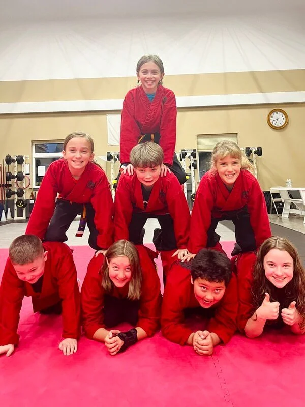 Girl having fun in a martial arts class for kids in Cicero and Liverpool, NY.