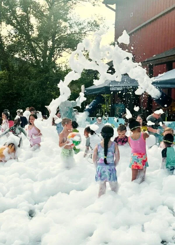 Kids enjoying an exciting foam party during summer camp at Karate John’s Martial Arts Center in Cicero and Liverpool, NY.