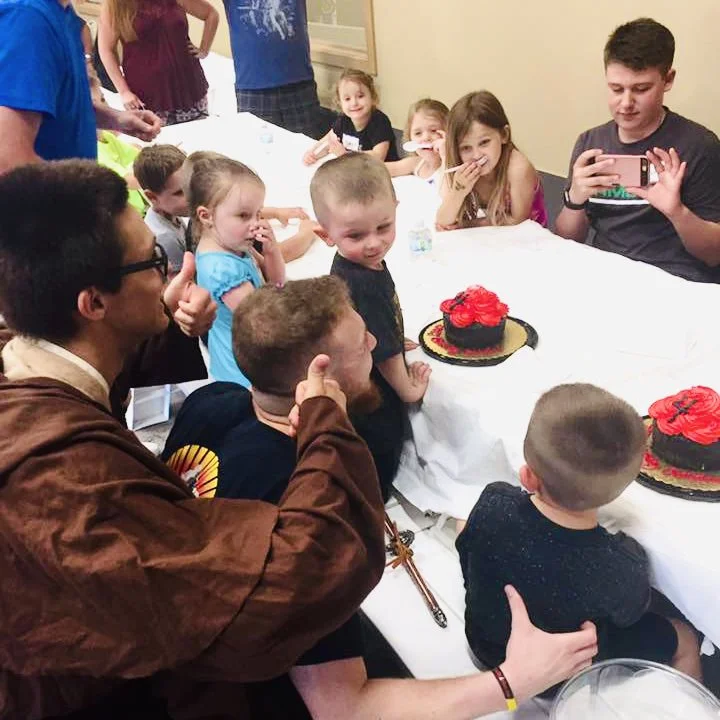 child cutting cake with a sword at birthday party in cicero liverpool, new york
