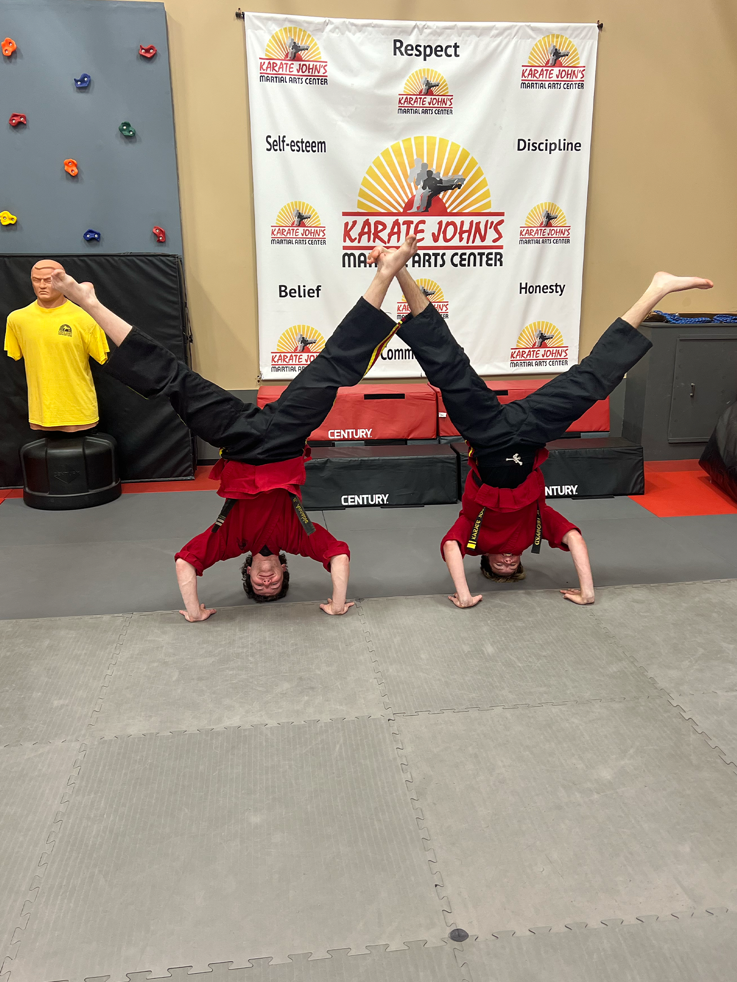 Two boys practicing self-defense in a self-defense class at Karate John's Martial Arts in Cicero and Liverpool, NY.