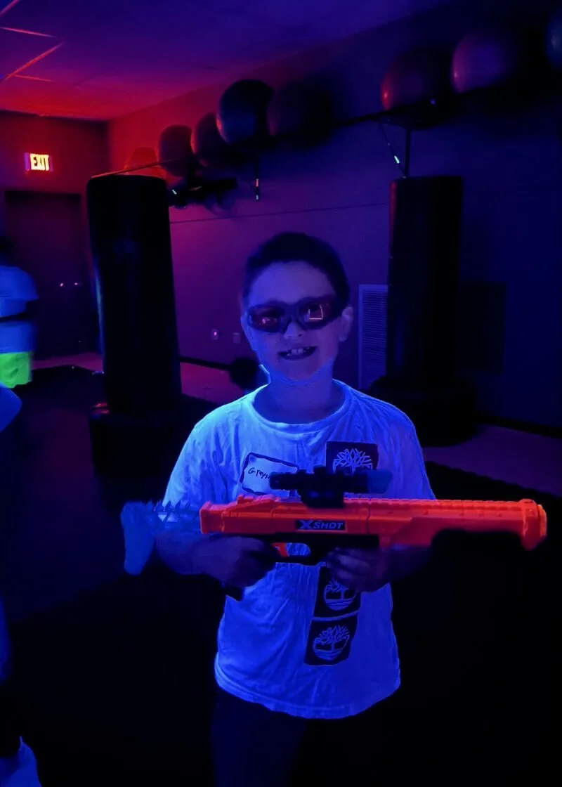Smiling child at a Nerf Blaster birthday party at Karate John's Martial Arts.