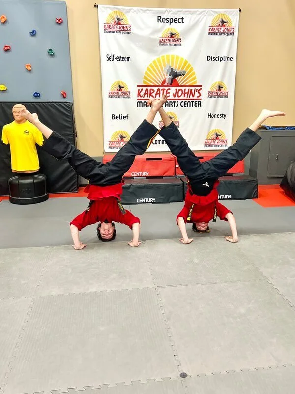 Children improving balance, coordination, focus and confidence in a kids karate class at Karate John’s Martial Arts Center in Cicero and Liverpool, NY.