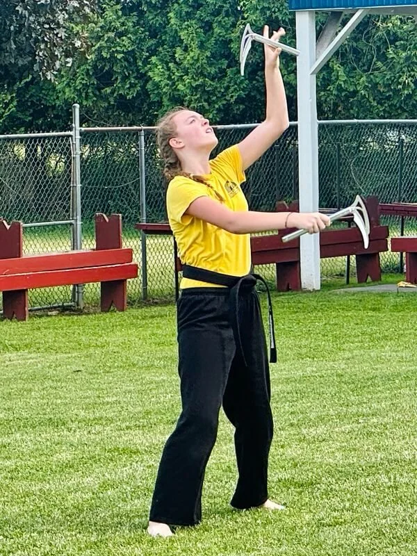 Teen martial arts student practicing advanced karate weapons training at Karate John’s Martial Arts Center in Cicero and Liverpool, NY, building coordination, focus, confidence and discipline.
