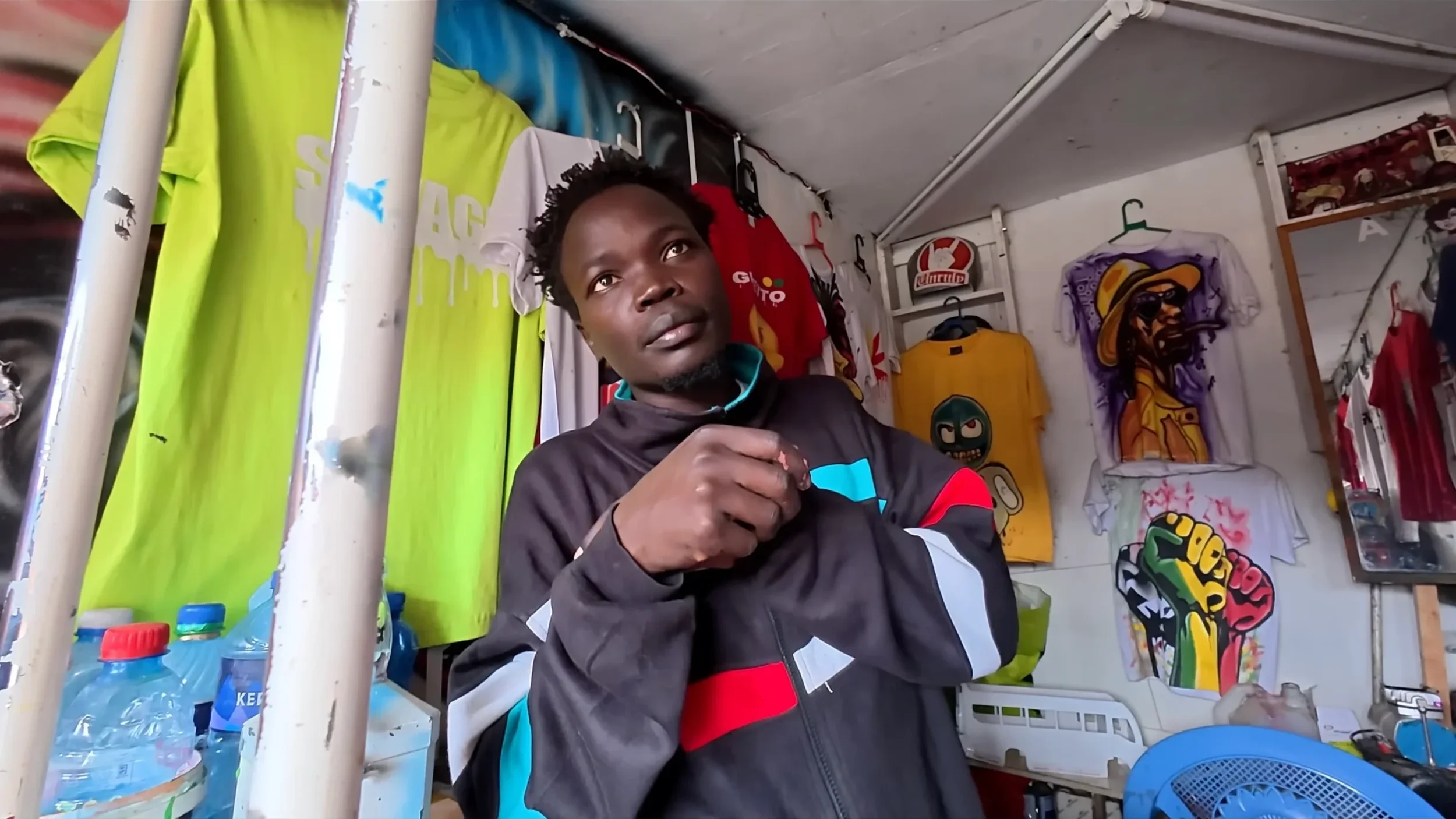 small custom t-shirt printing shop inside Kibera