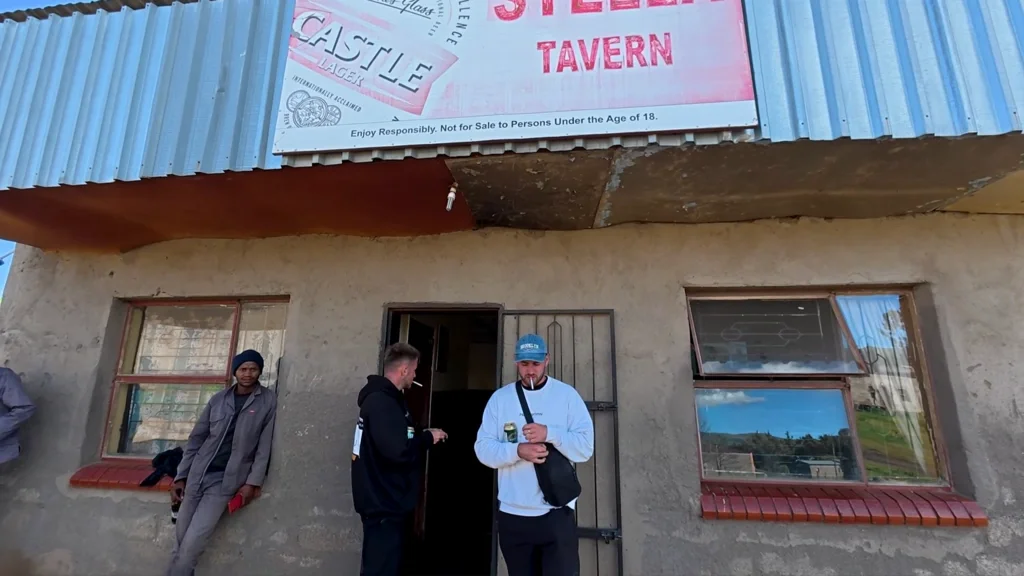 In front of the local bar