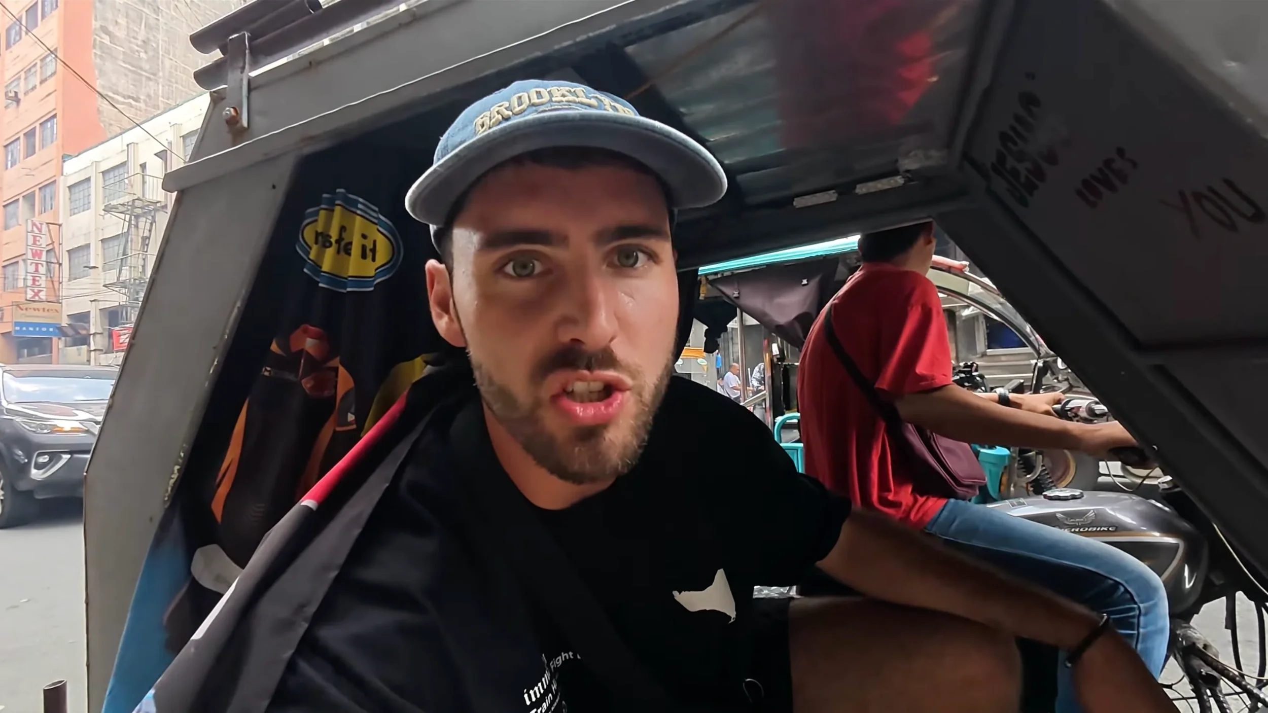 Riding a Filipino tricycle on a Manila street