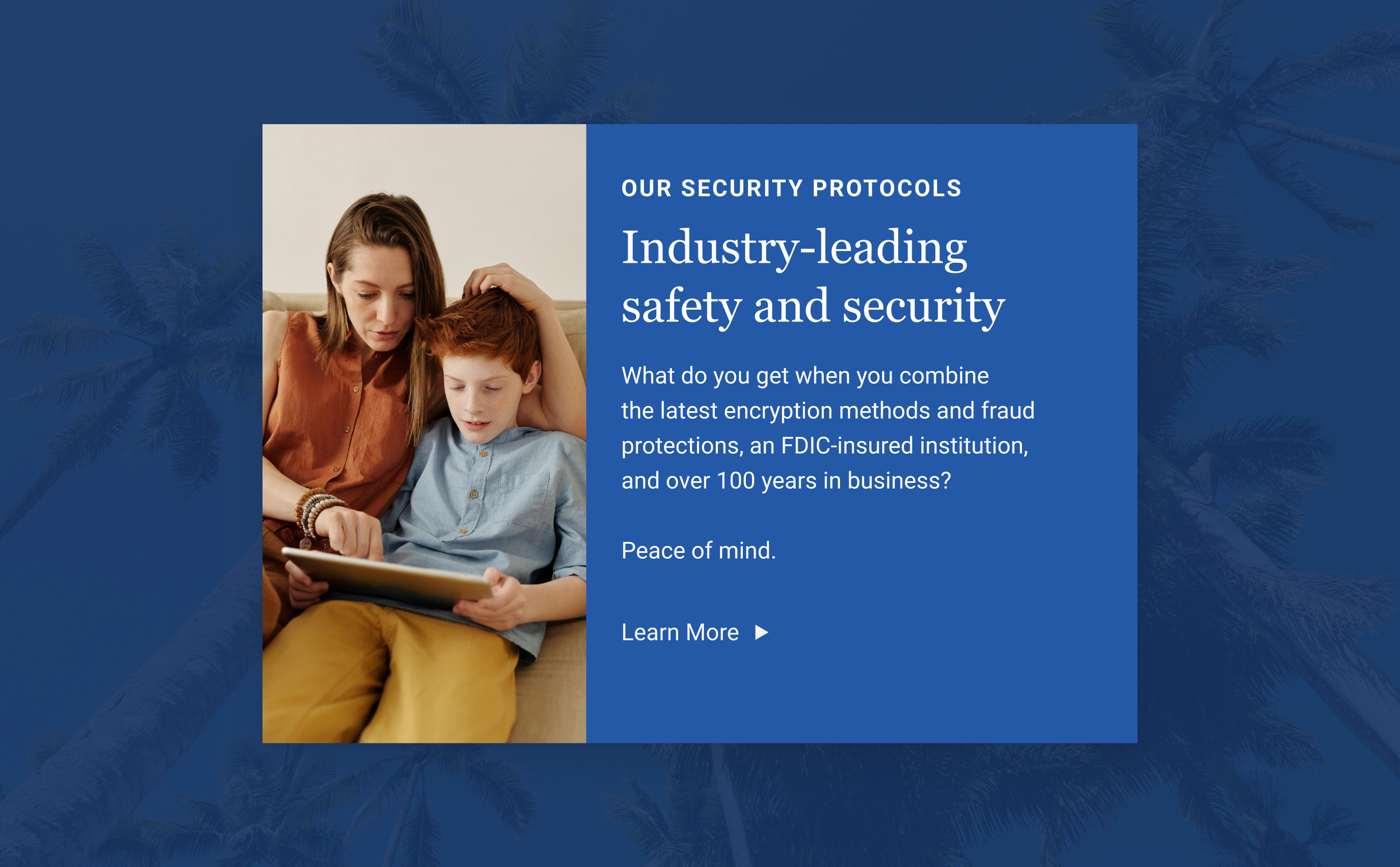 A woman and a boy sitting on a couch looking at a tablet together with palm trees in the background.