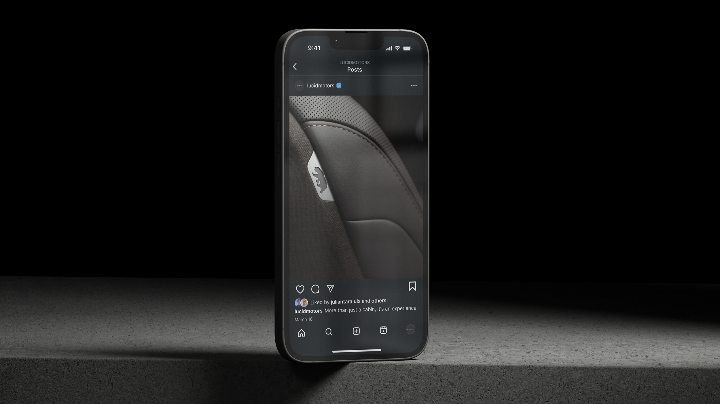 Smartphone displaying an Instagram post of a car interior with black leather and orange stitching.