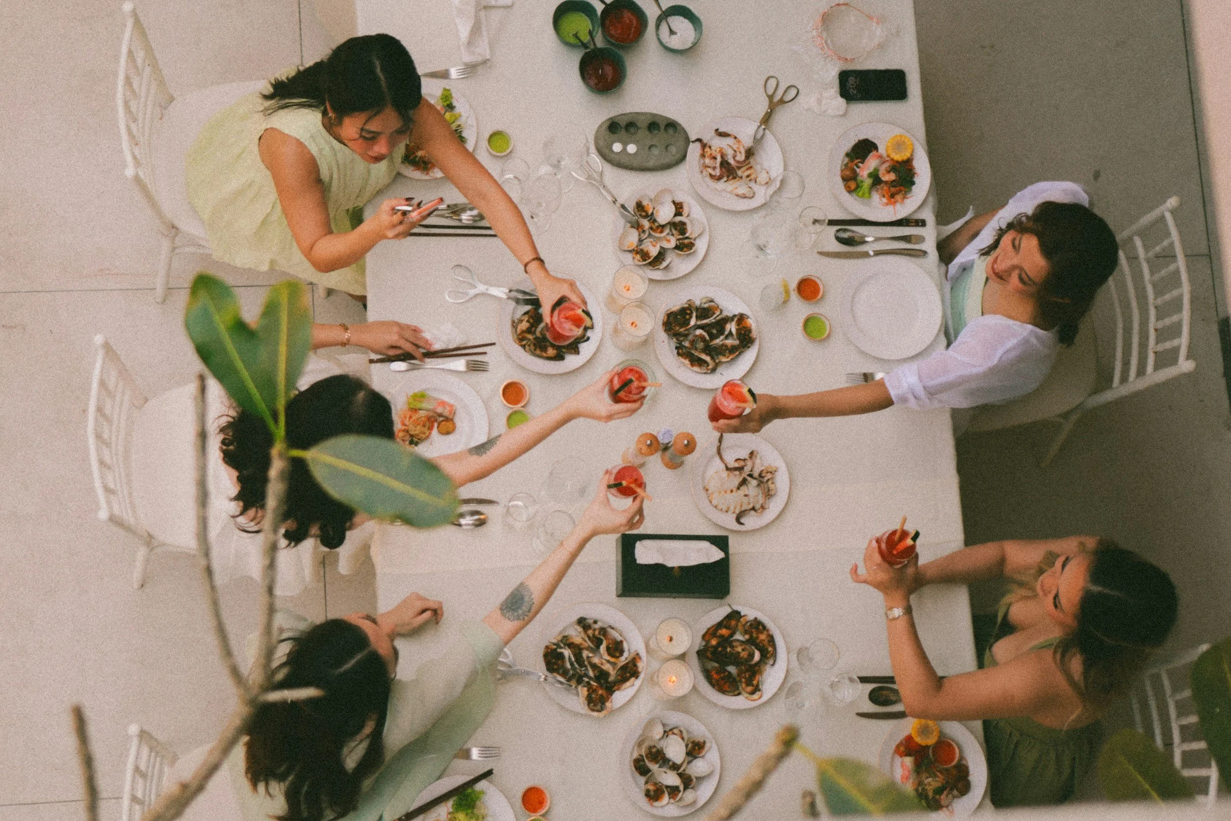Friends enjoying a dinner party showing food is more than just nutrients but also joy and connection.