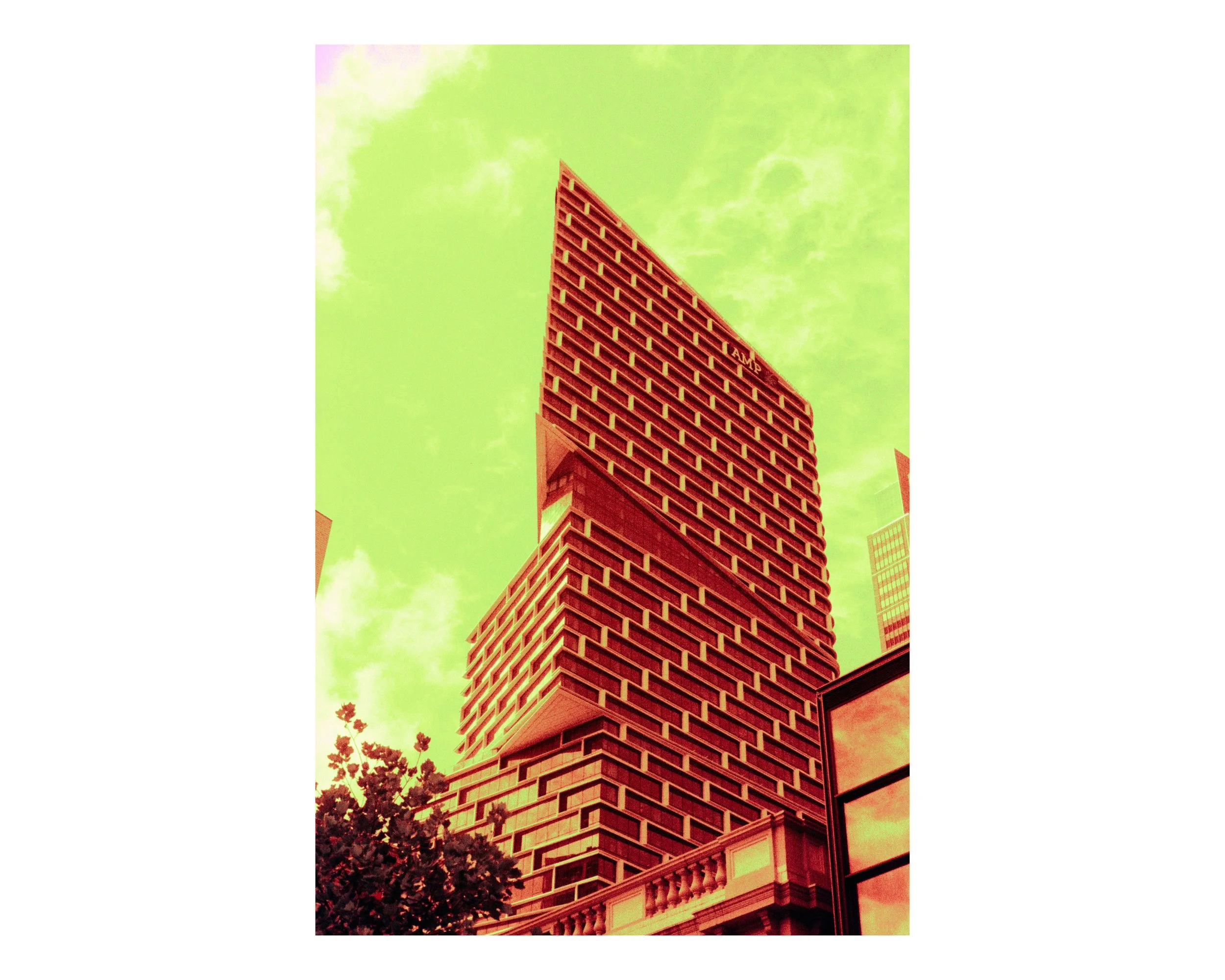 A tall modern building with a distinctive brick-patterned facade against a green-tinted sky with clouds, in an urban setting.