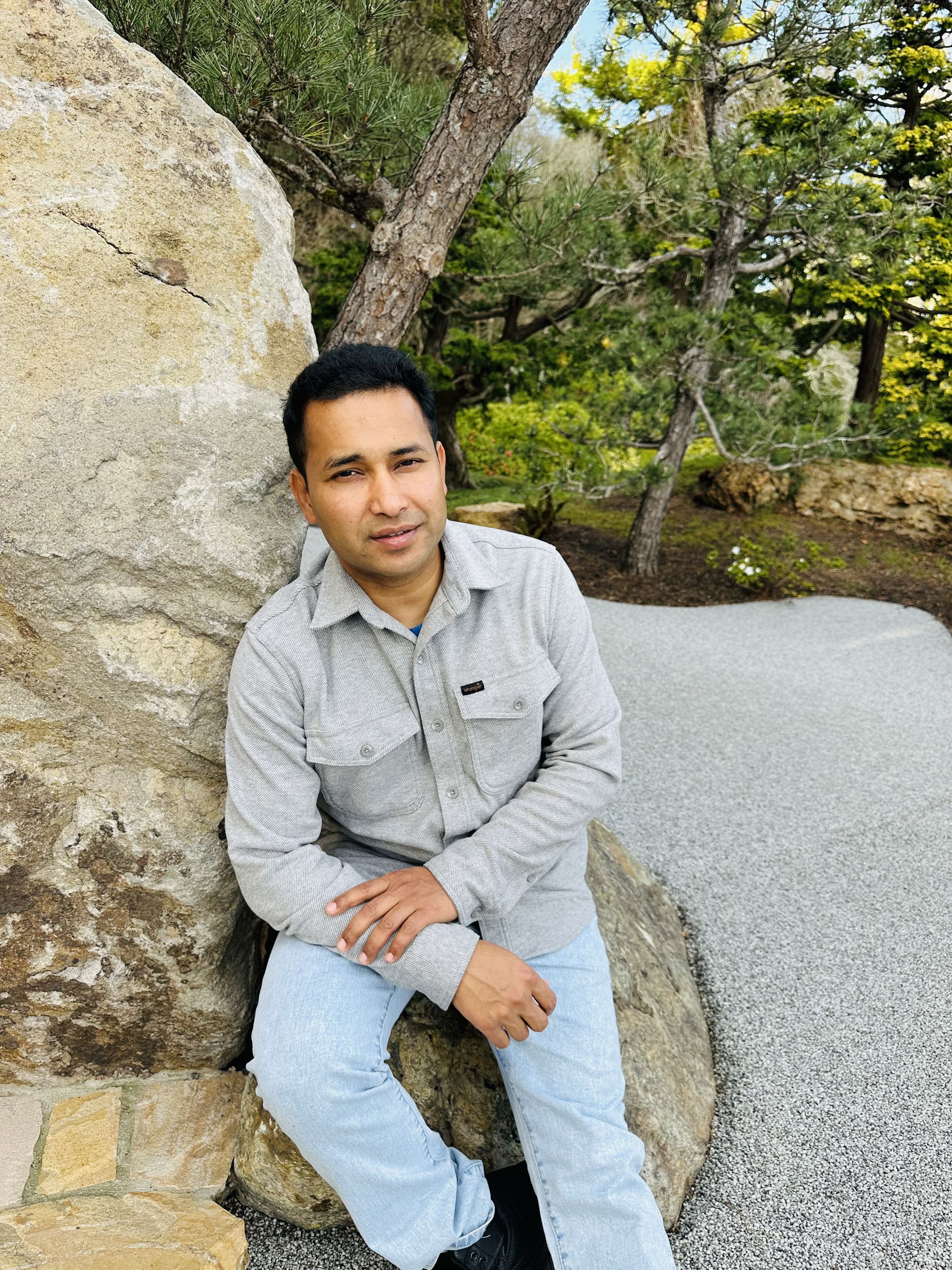 Roshan leaning on Rock 