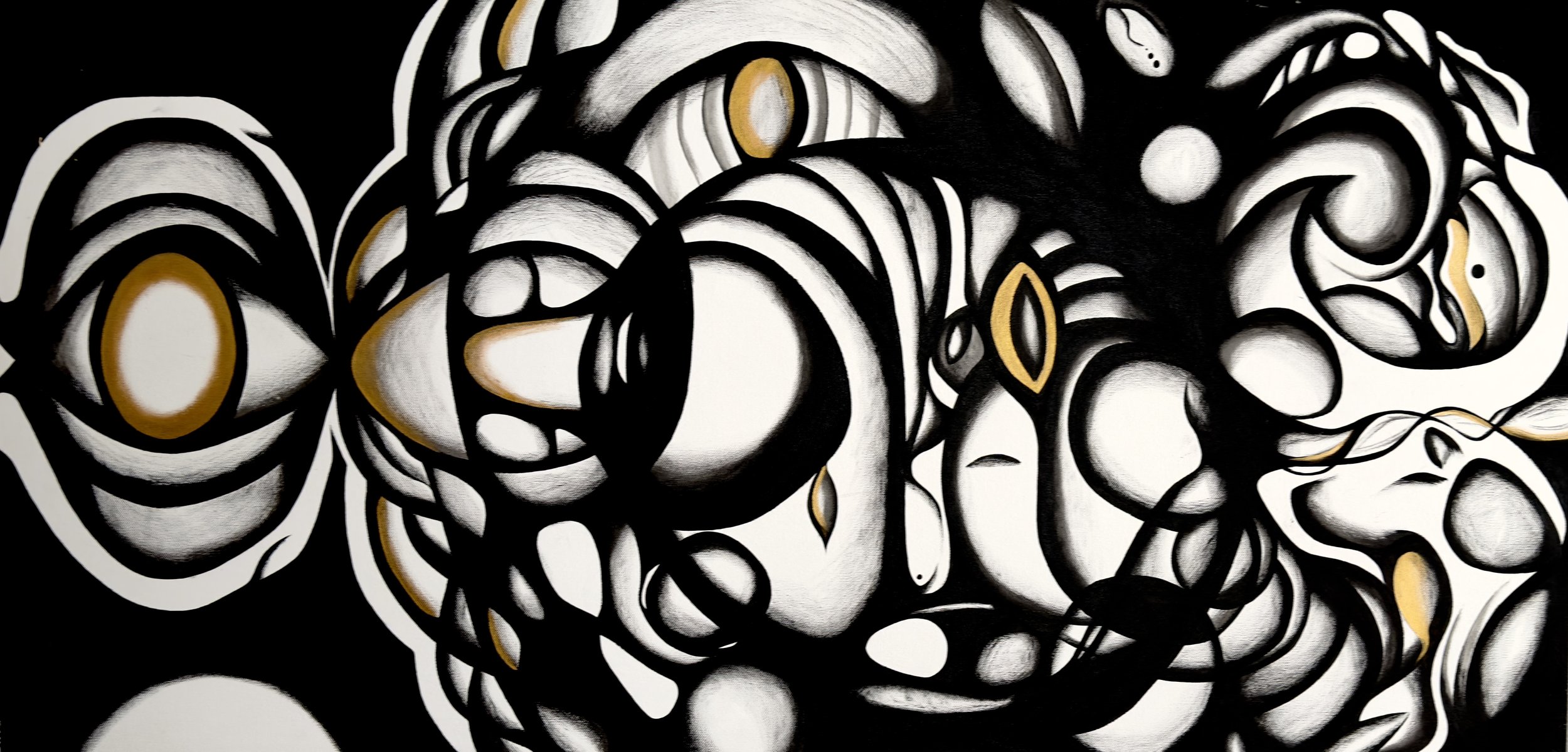 Abstract black and white graffiti art with gold accents, featuring swirling patterns and concentric circles.