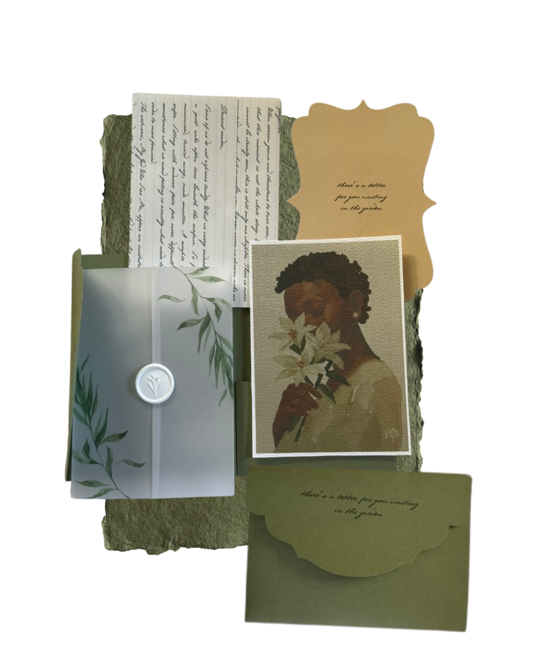 A collection of stationery and art items, including handwritten letter, printed card with an illustration of a woman holding flowers, a small folded card with the text 'there's a letter for you resting in the garden,' and an envelope with leafy design.