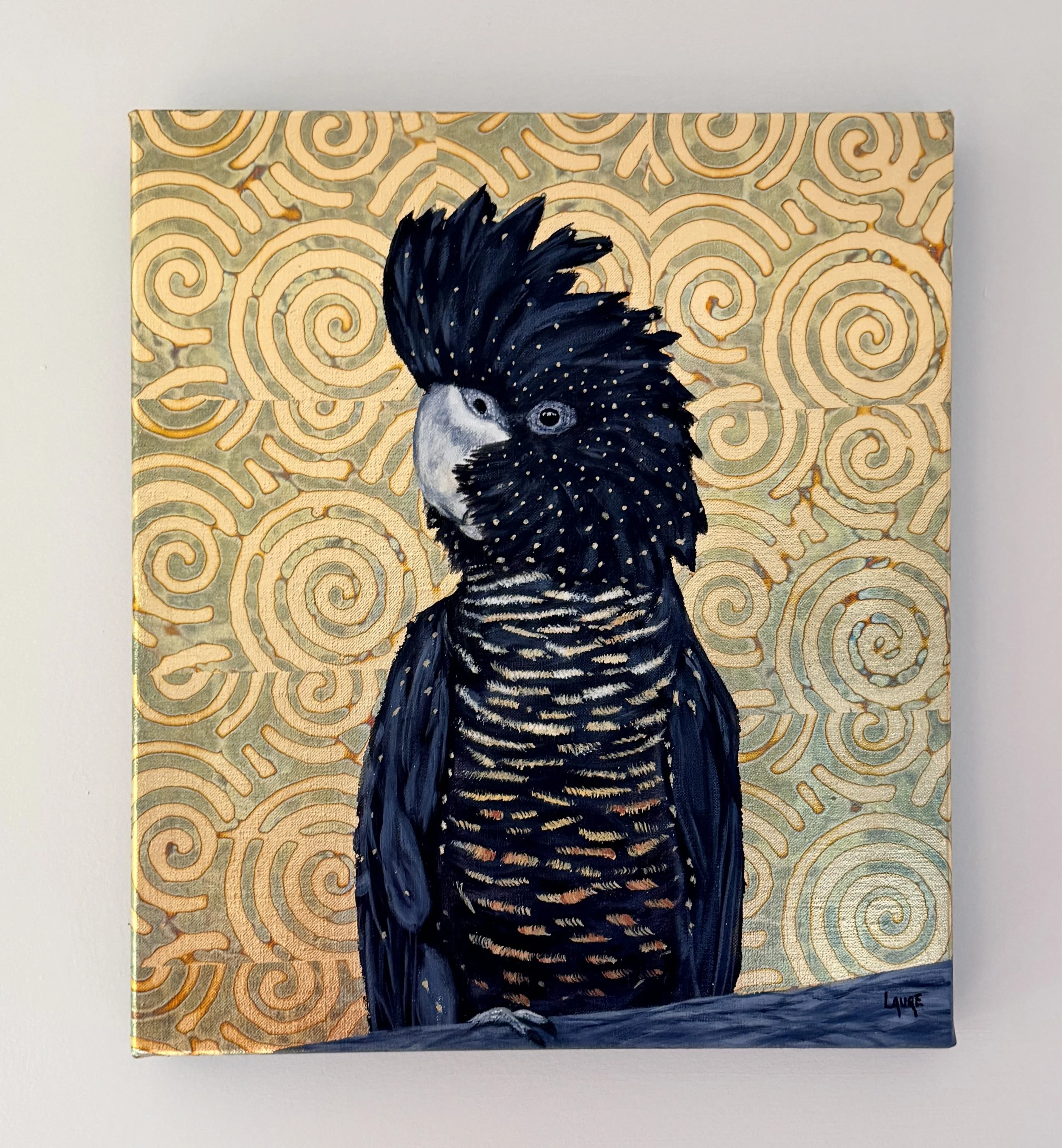 Black cockatoo in golden bush