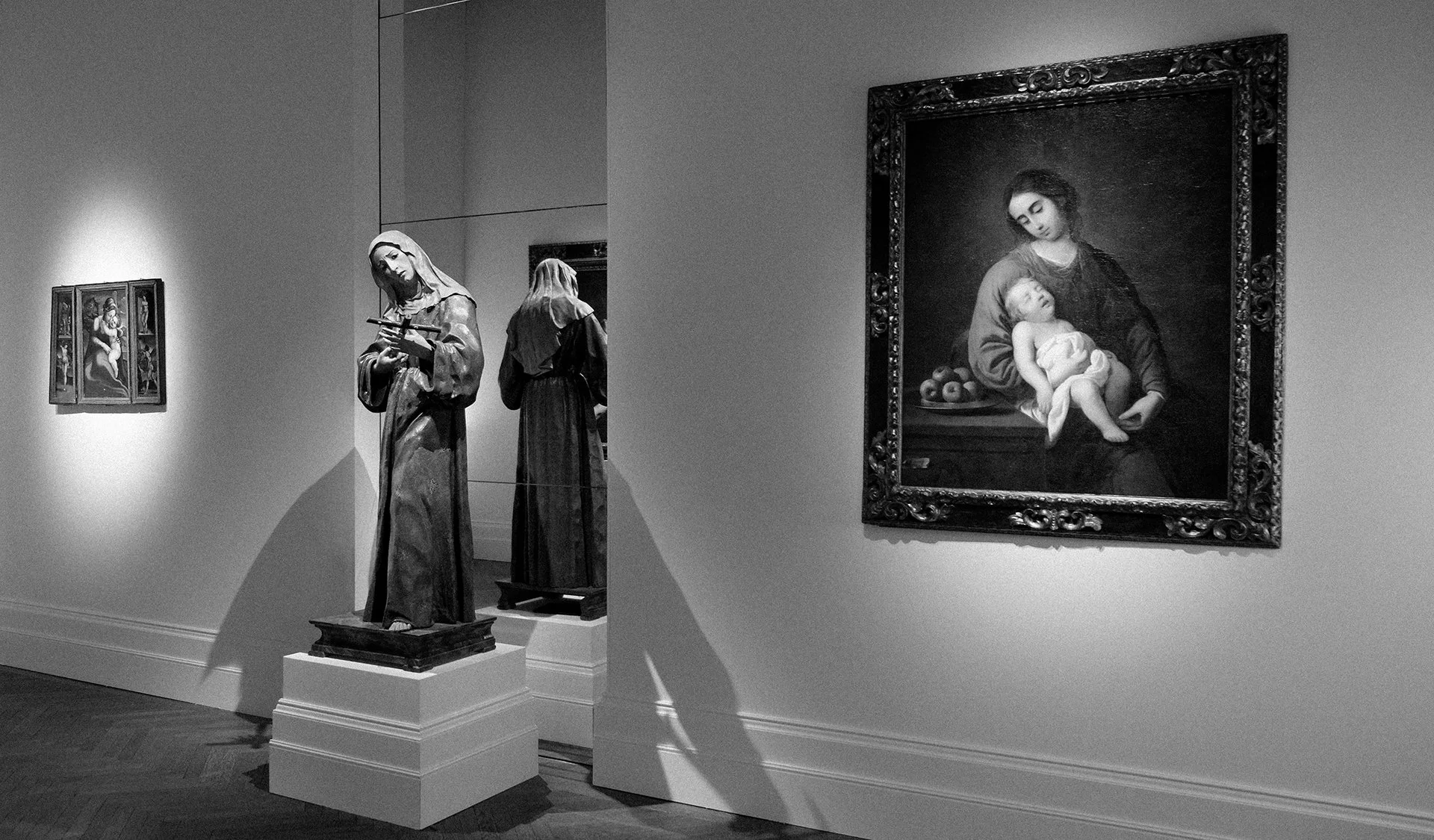 Art Fair Booth Gallery exhibition interior with paintings and sculptural presentation.