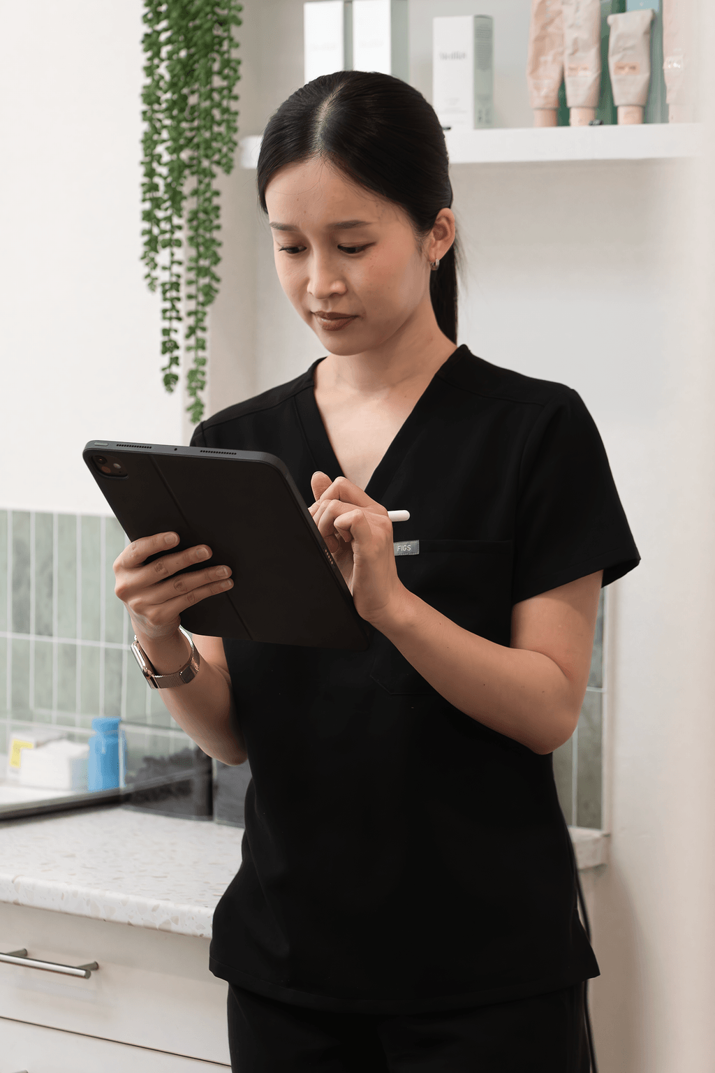 Nurse Tania Nguyen at Define Clinic consulting a patient