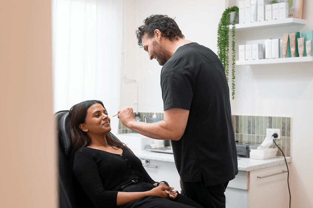 Dr Joshua Mullins at Define Clinic consulting a patient