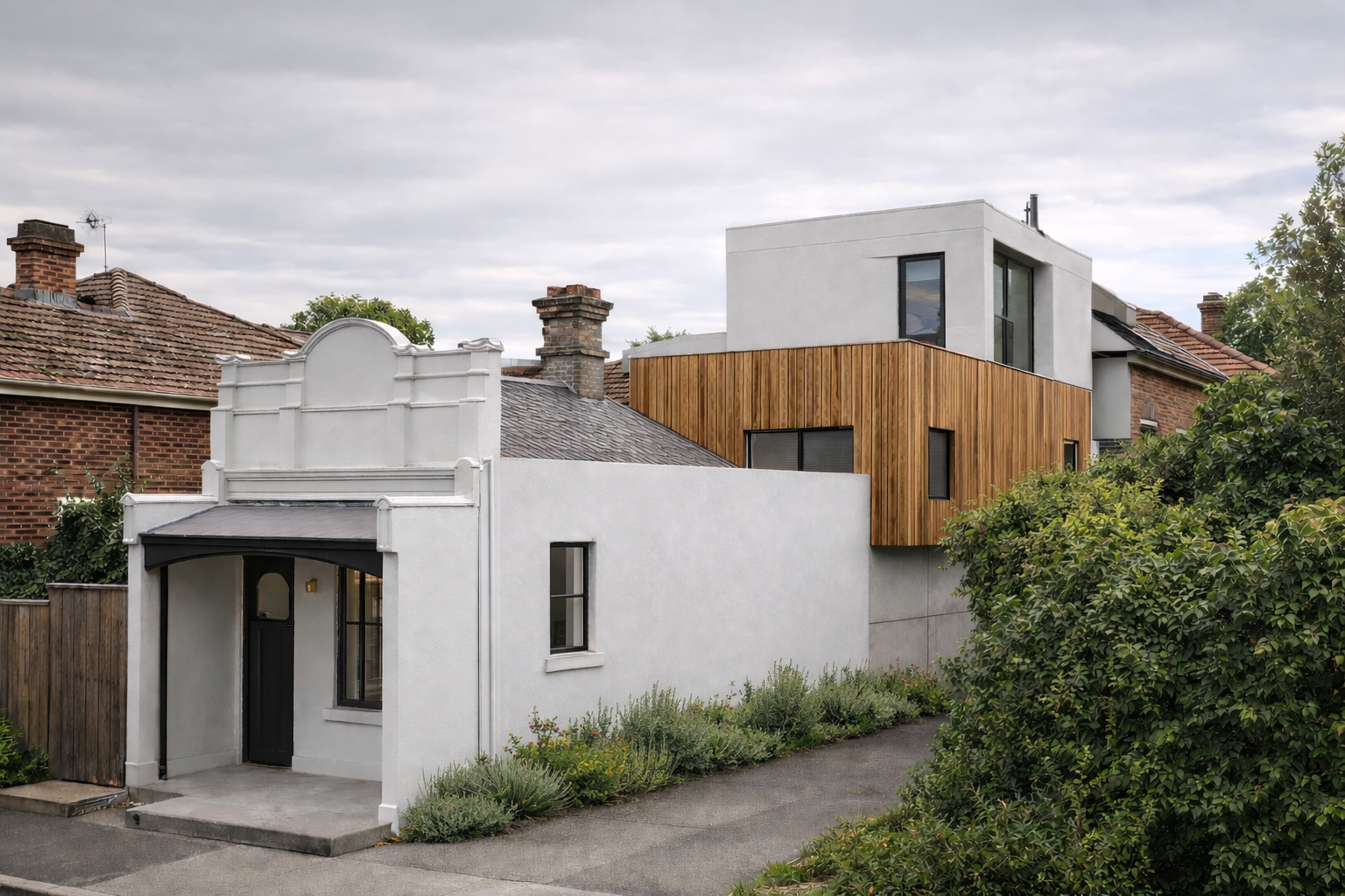 Victorian terrace home renovation in Melbourne featuring a modern concrete and timber rear extension. Design and build project combining heritage façade restoration with a contemporary architectural addition by Box Domus.