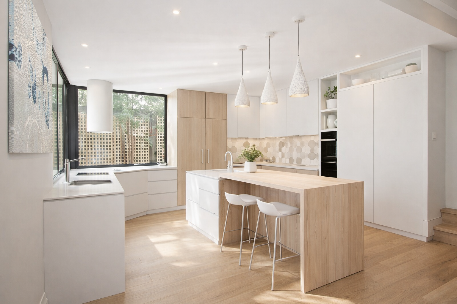 Modern light kitchen renovation in Hawthorn with minimalist white cabinetry, timber island and contemporary pendant lighting.