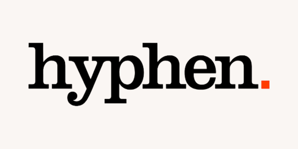 The word Hyphen logo with a period in red at the end.