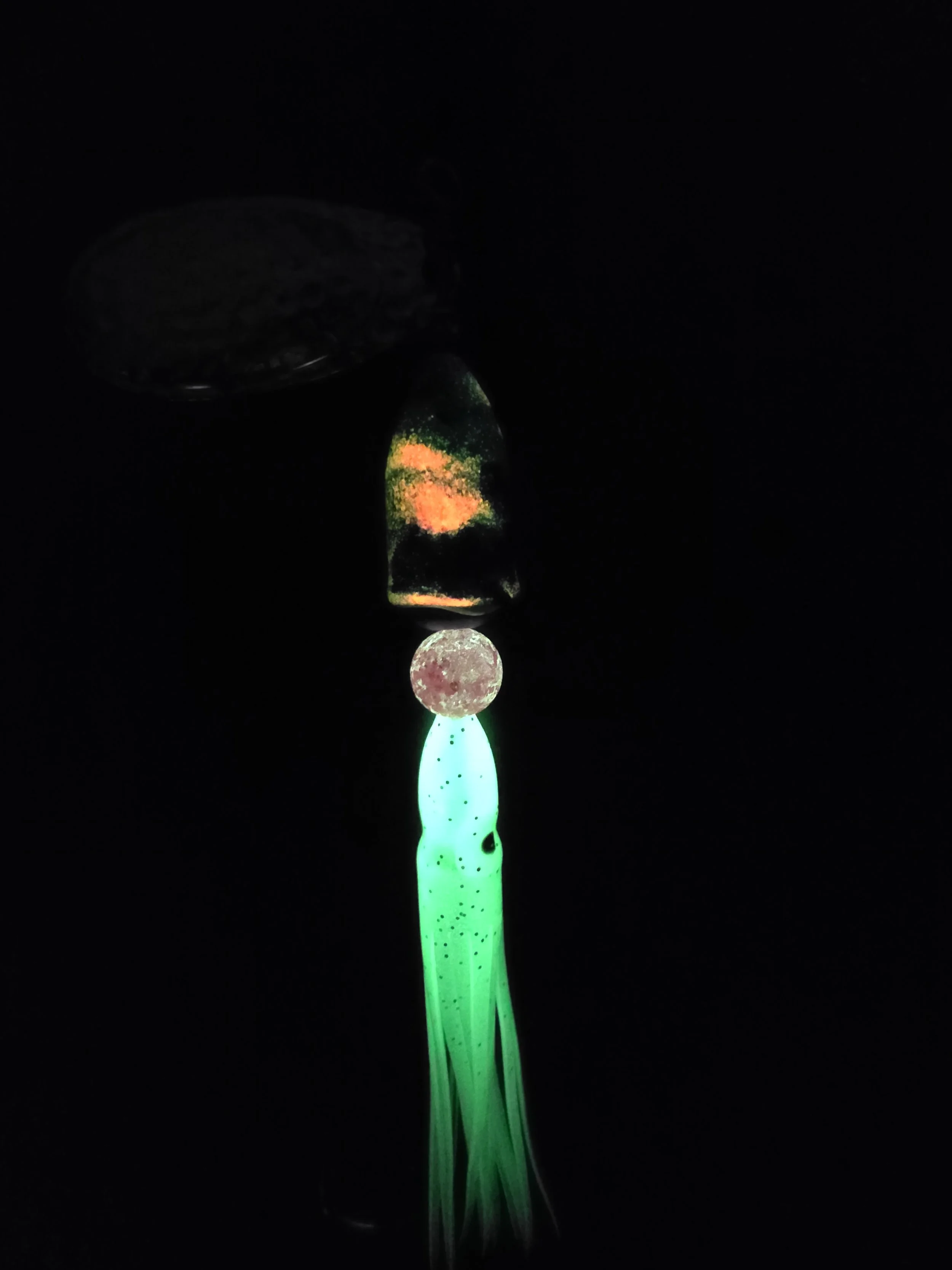 UV light view of the Kamakazi Graffiti spinner highlighting the high-intensity glow hot pink and chartreuse green paint.