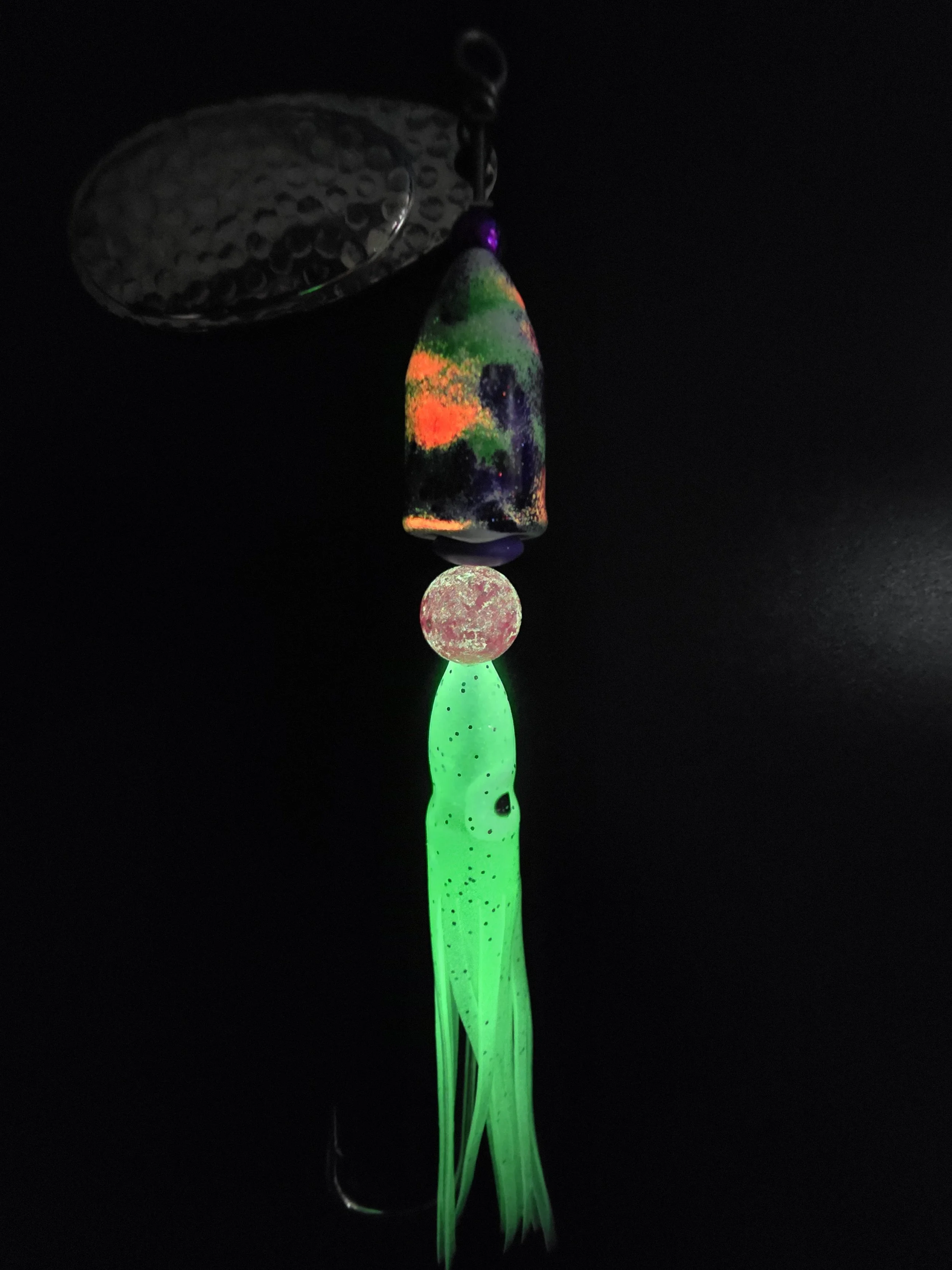 UV light view of the Kamakazi Graffiti spinner highlighting the high-intensity glow hot pink and chartreuse green paint.