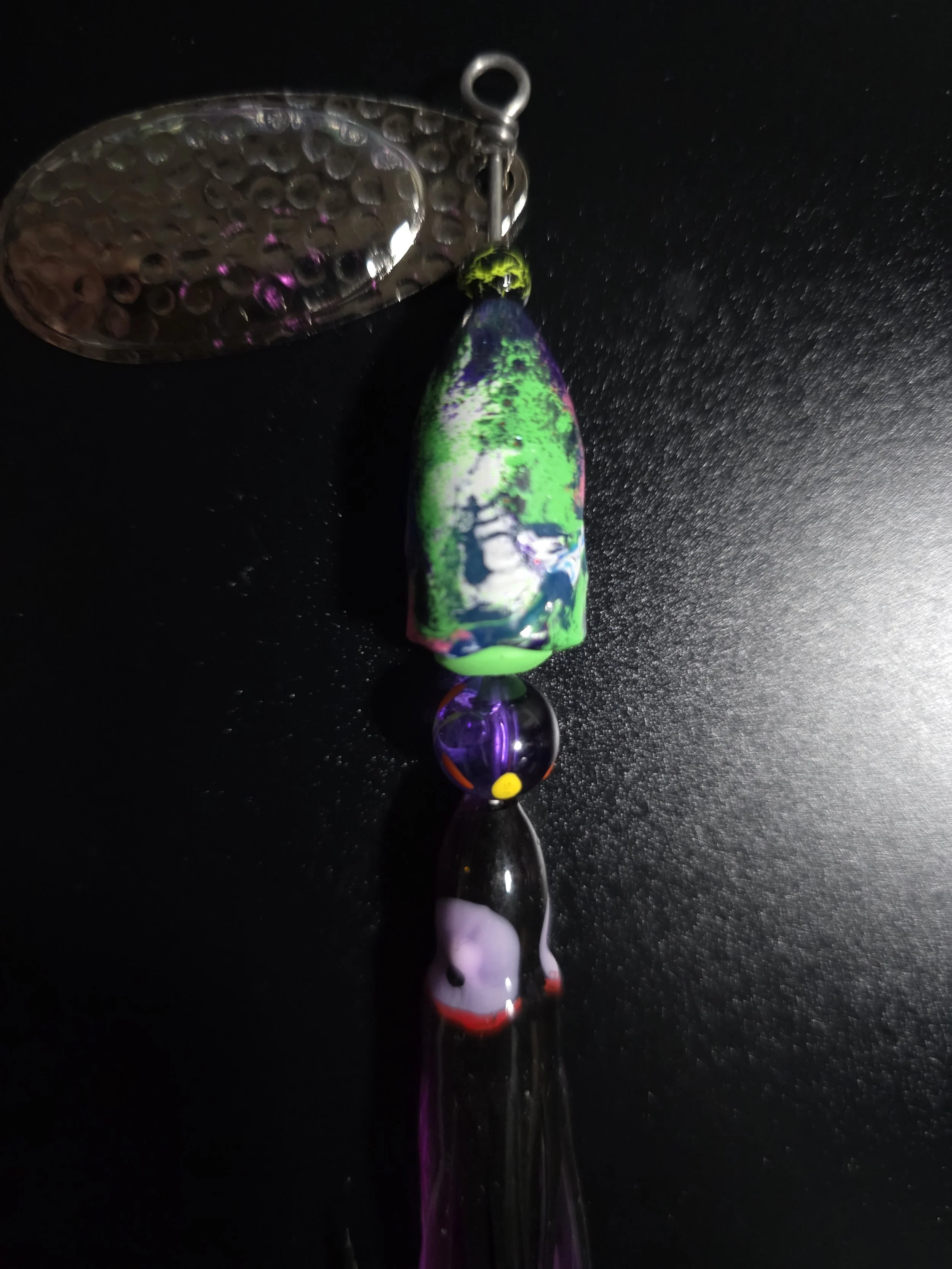 High-flash chrome blades on the KAMAKAZI Electric Purple custom spinner for maximum underwater visibility.