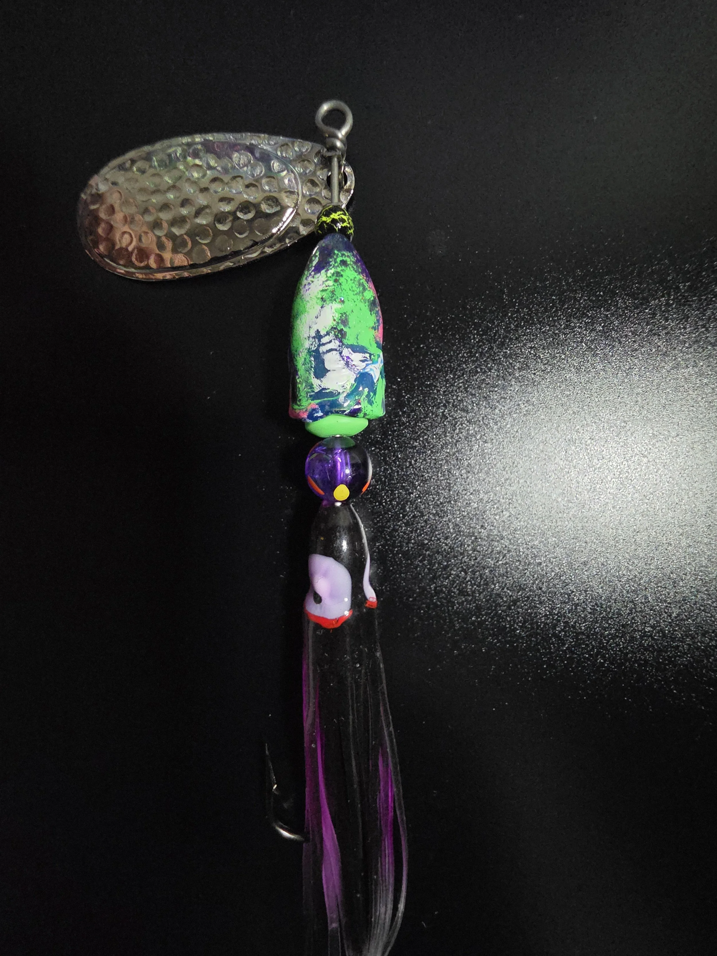 Heavy-duty single hook on the custom 3/4 oz KAMAKAZI Electric Purple fishing lure.