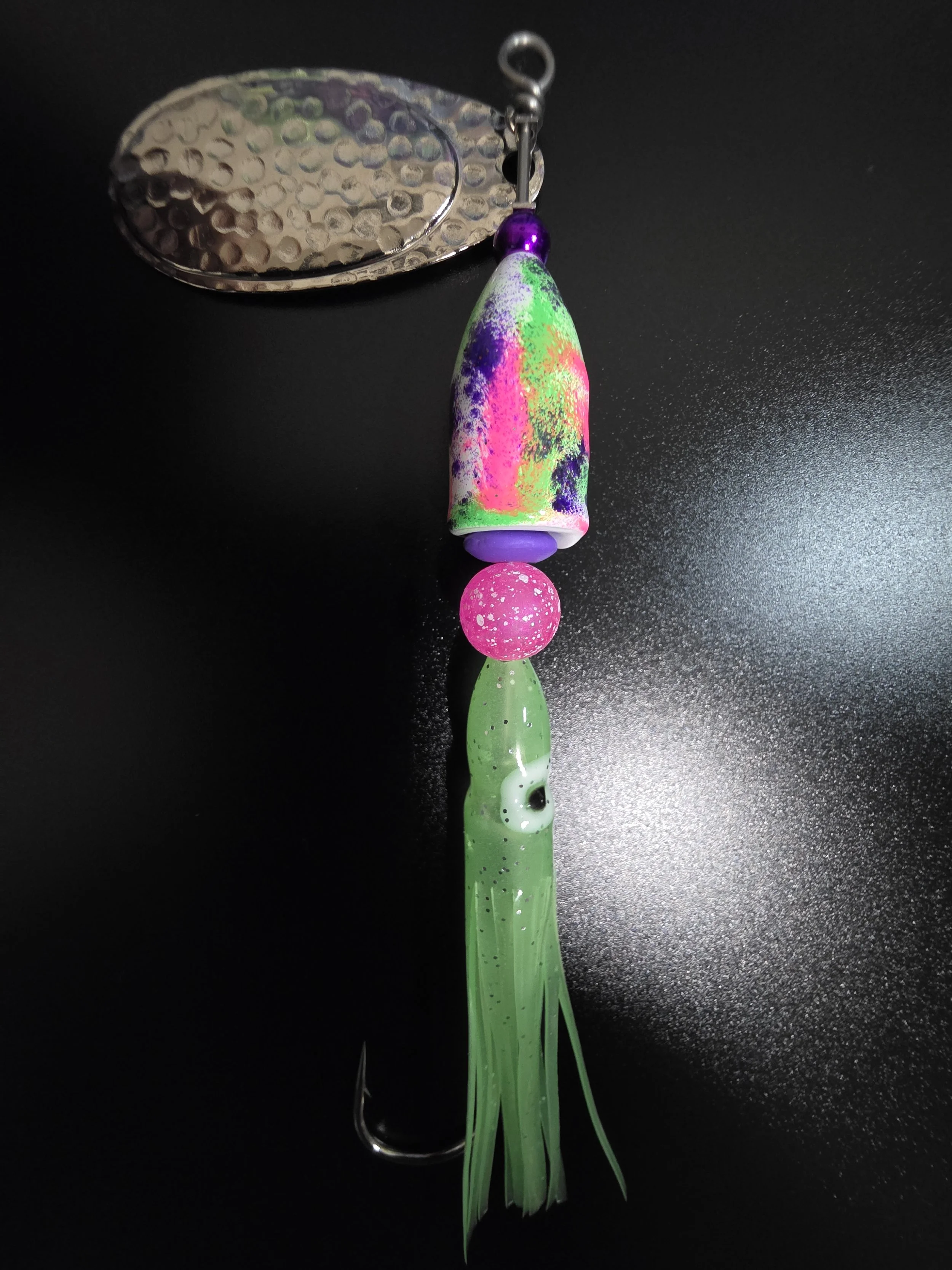 UV light view of the Kamakazi Graffiti spinner highlighting the high-intensity glow hot pink and chartreuse green paint.