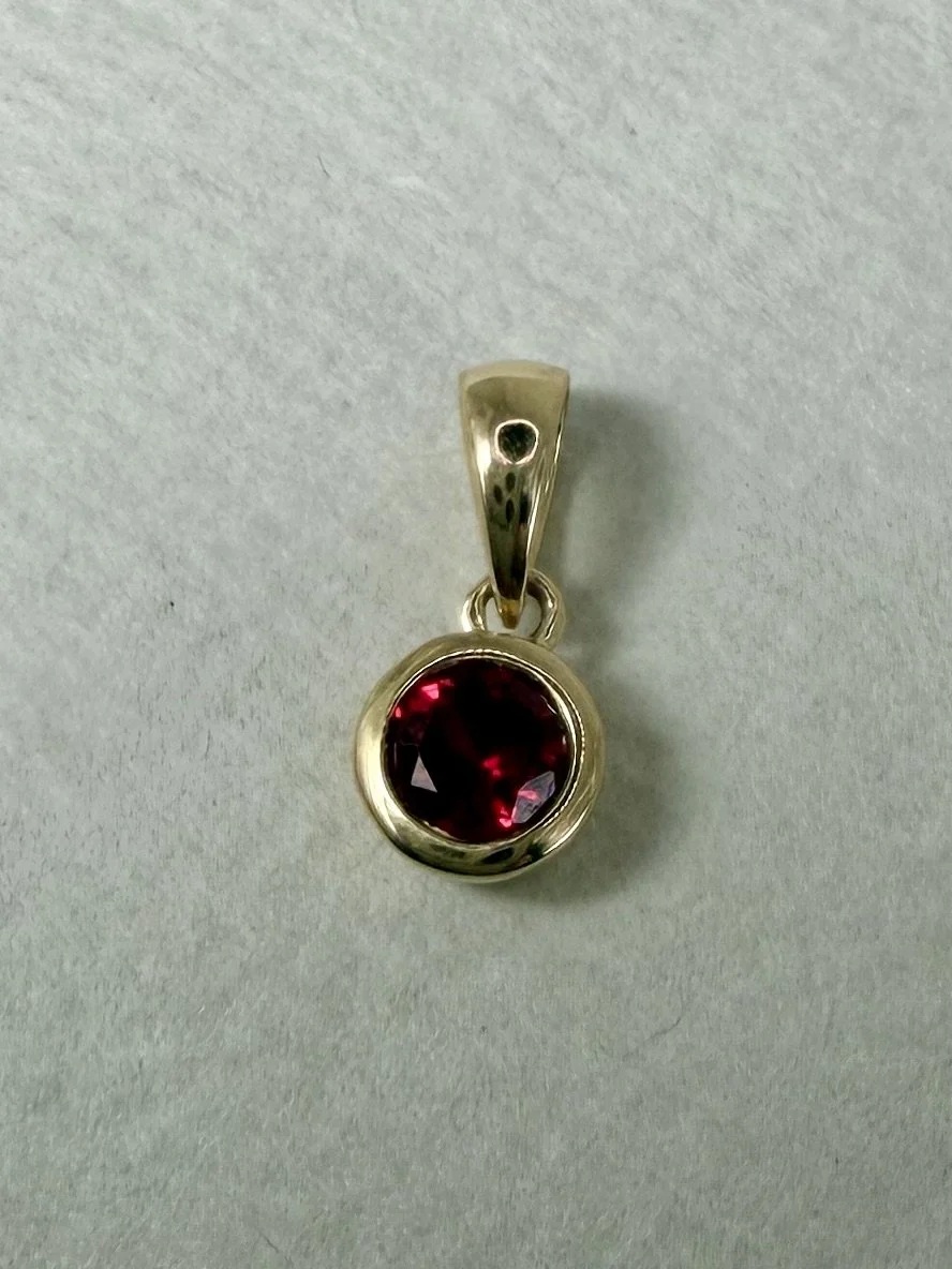 9 carat gold ruby charm