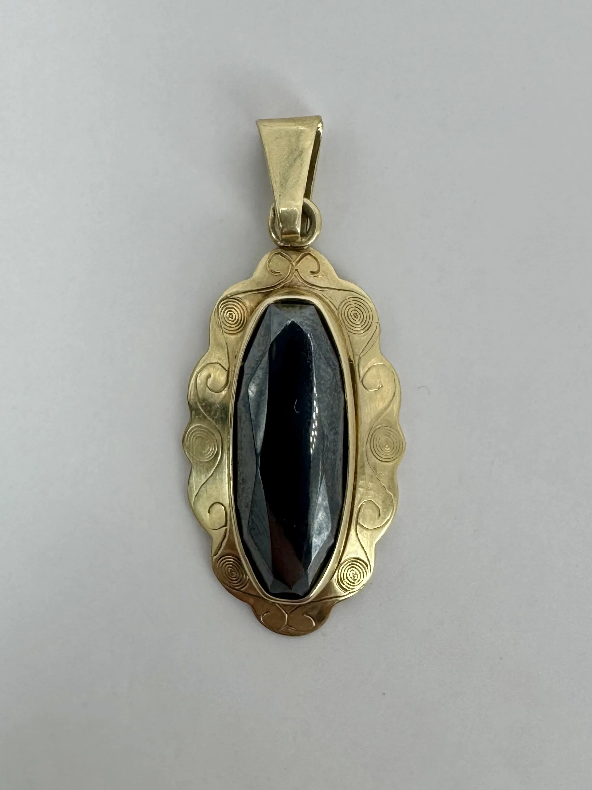 14 carat gold hematite pendant
