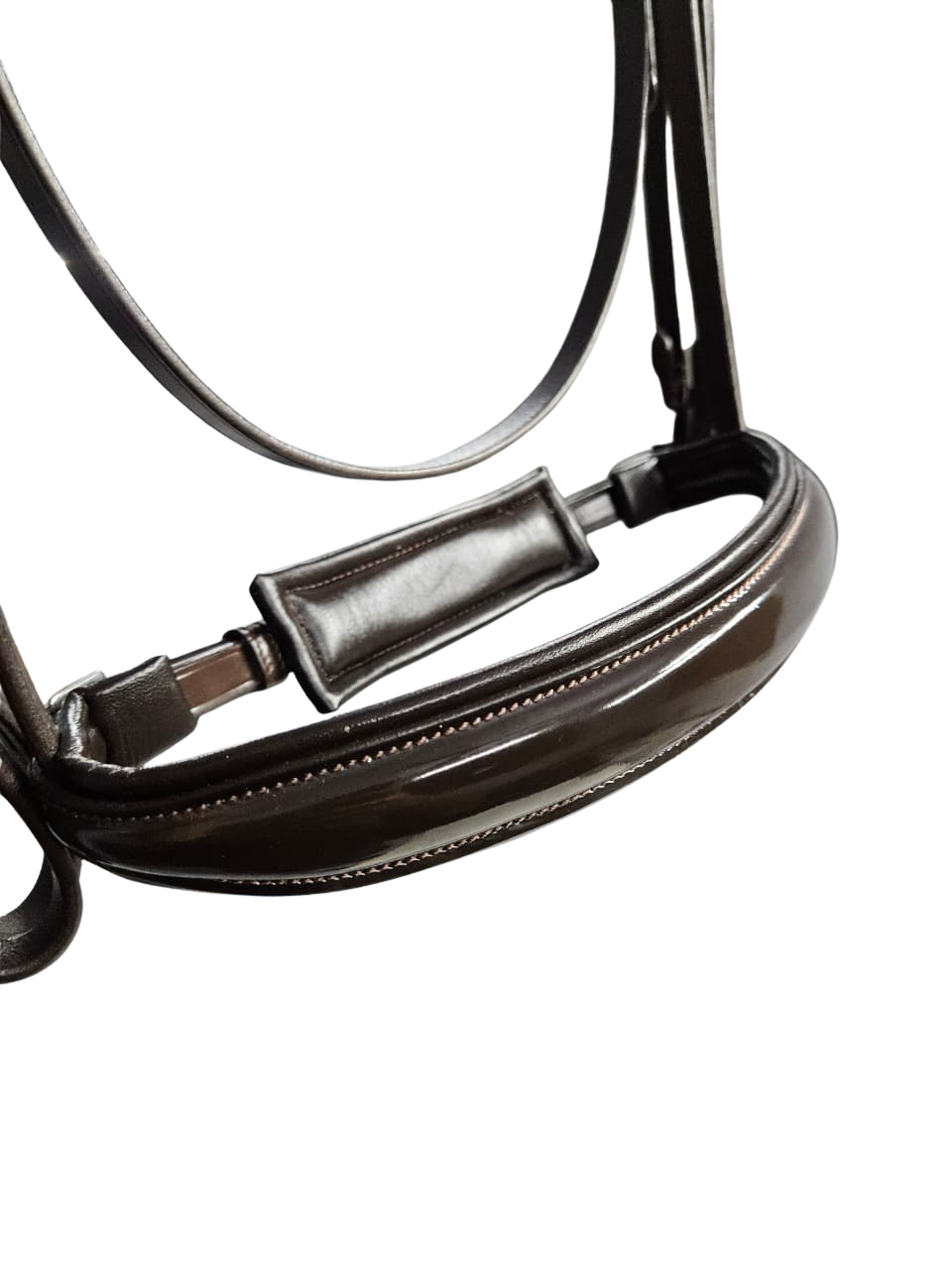 Close-up of brown padded anatomical bridle noseband with patent leather