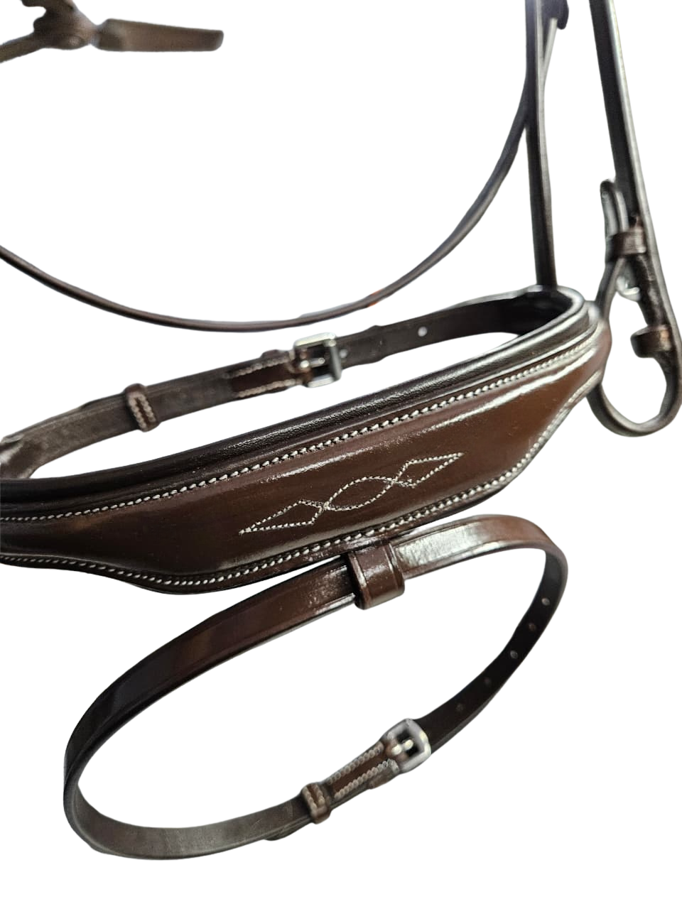 Close-up of brown padded anatomical bridle noseband with fancy stitching

