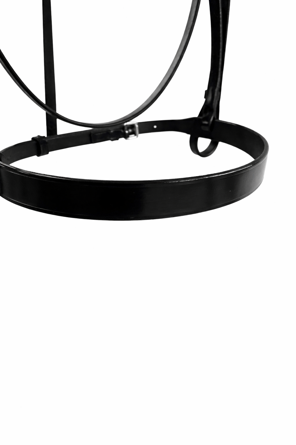 Close-up of a black metal baseball cap visor against a white background.