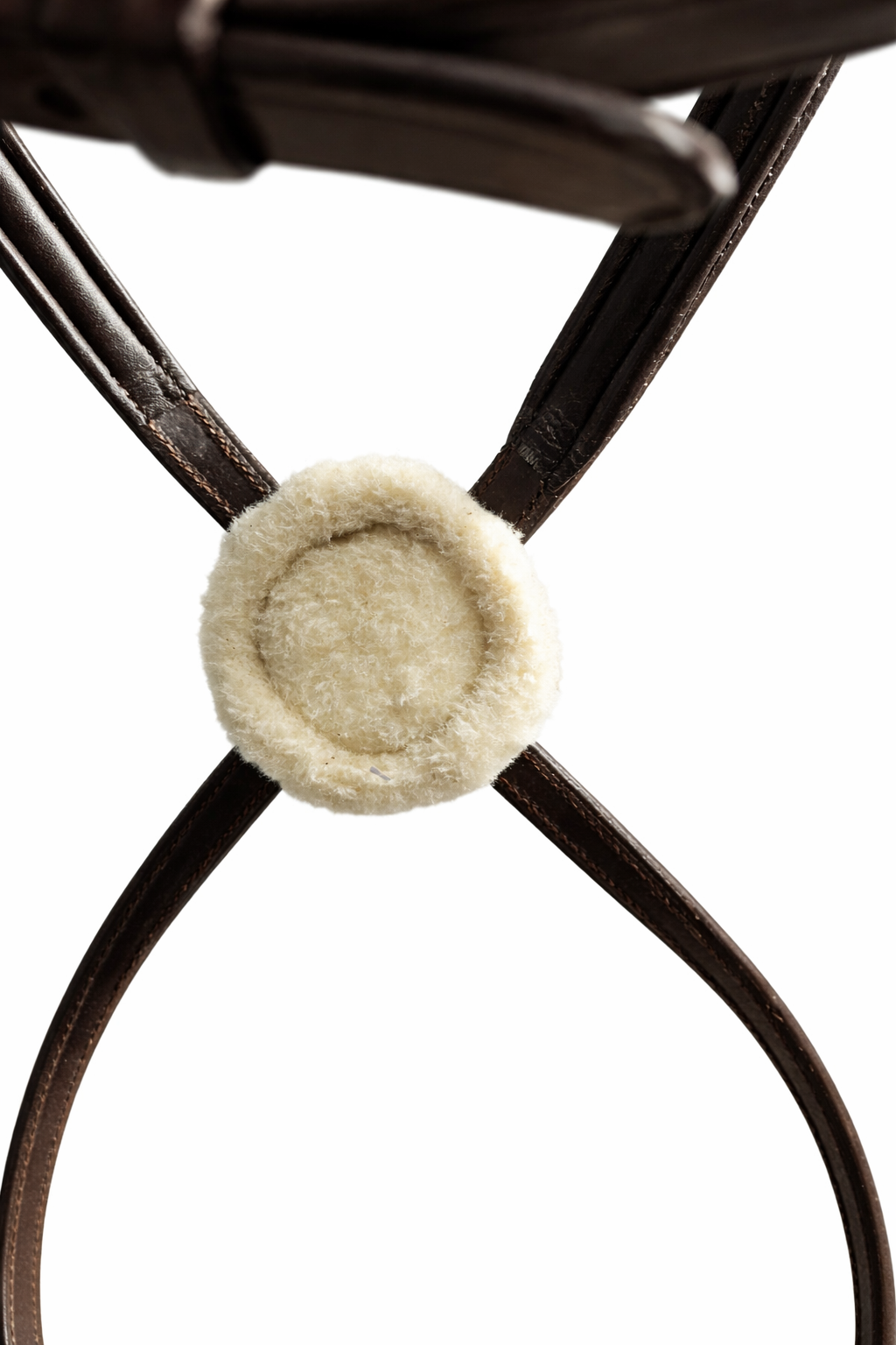 Close-up of center pad on brown figure 8 bridle noseband