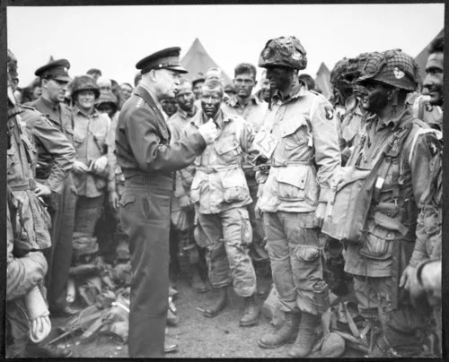 General Dwight David Eisenhower talking to soldiers in the field during World War II. KM 221783.jpg