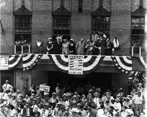 Dwight D. Eisenhower views the homecoming parade In Abilene, Kansas. June 6, 1952. Photo by Lester Green. [64-555-2] EPL.jpg